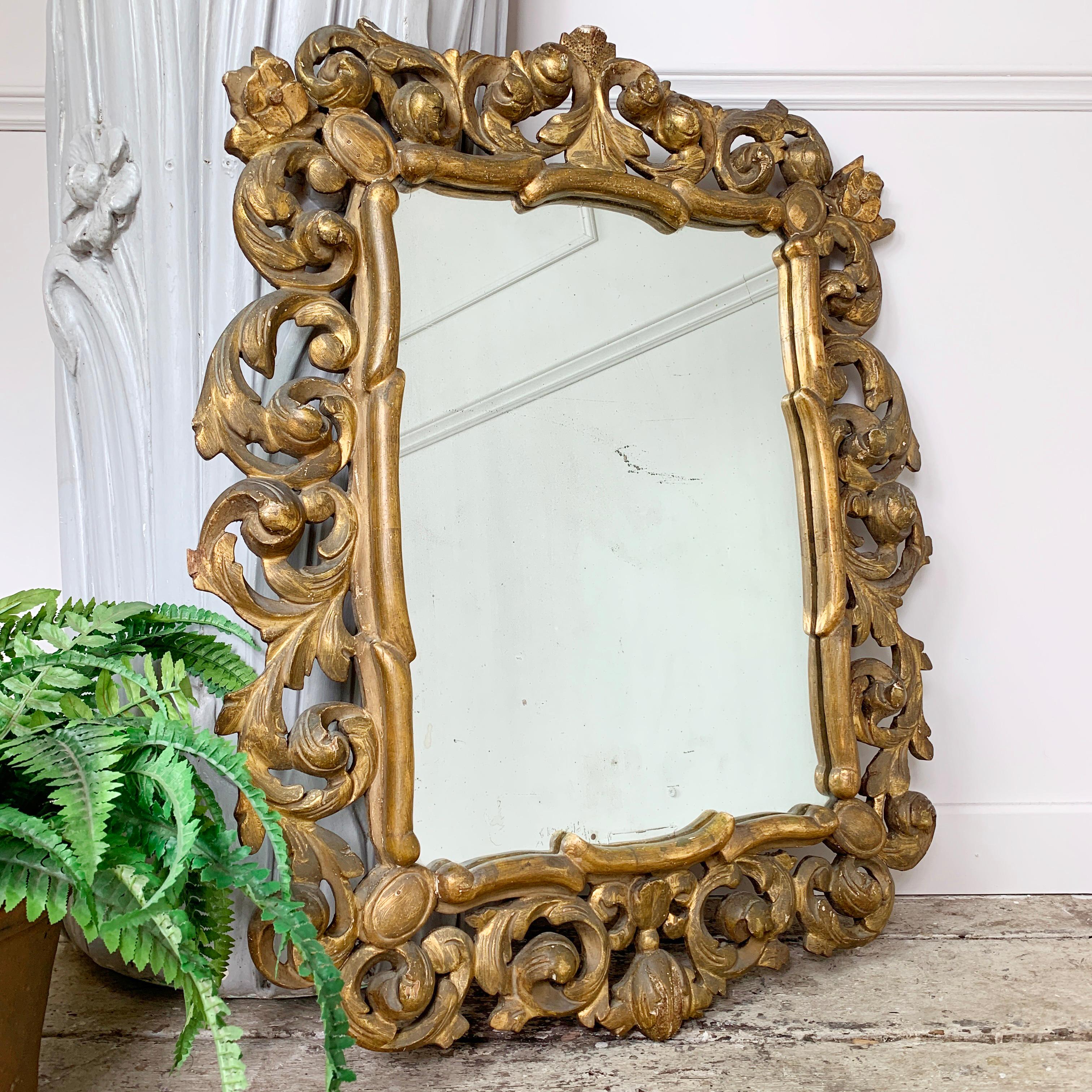 Italian gilt carved wooden mirror, c 1830's
Deeply carved baroque style acanthus leaves and detailing. Original Gilt finished the carved wood
87.5cm height, 73cm width, 6.5cm depth, mirror glass 56cm height x 41cm width
Hanging hook on the