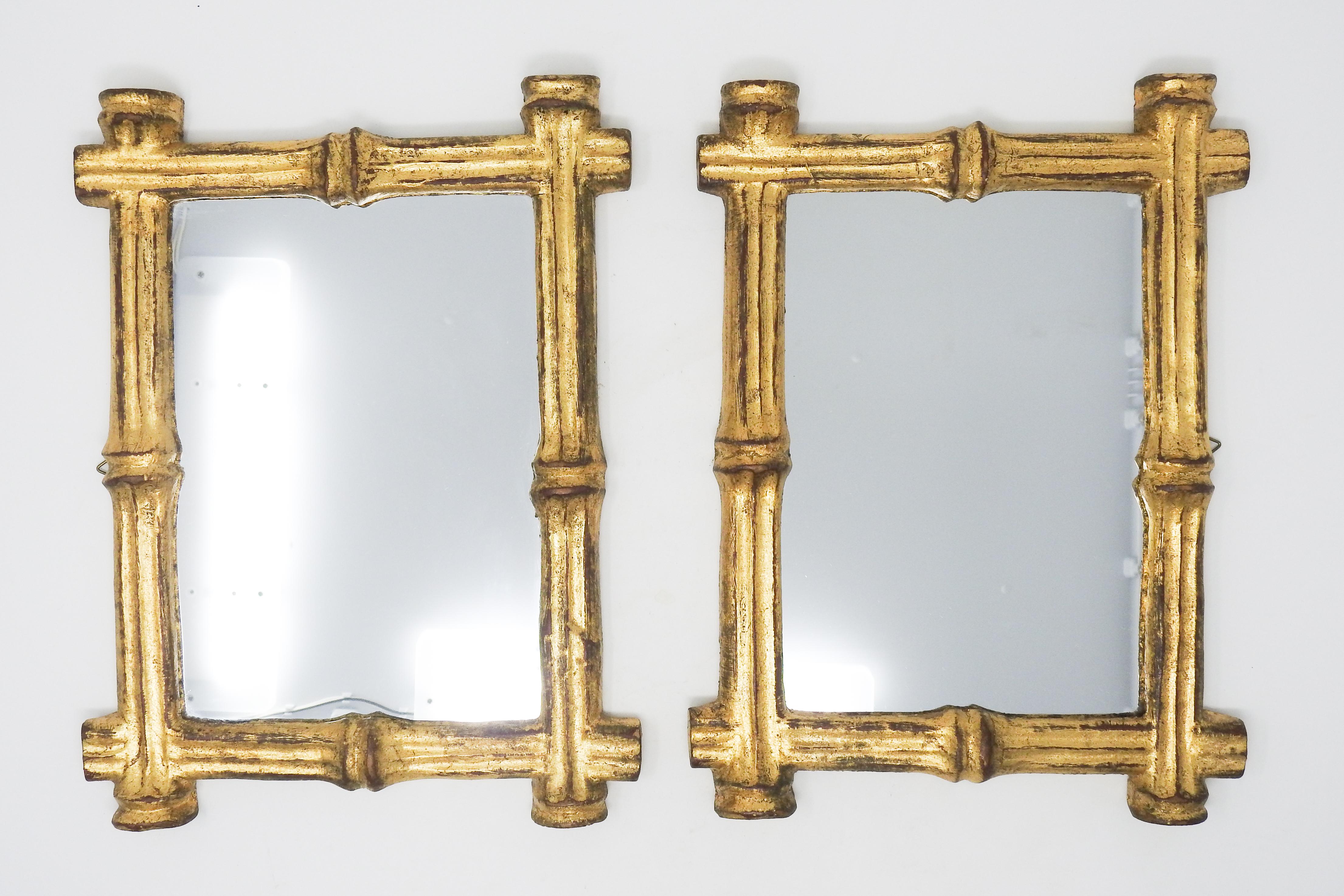 Offering this pair of Italian Florentine bamboo style mirrors. These mirrors are an adorable pair that will add a cute look to any room. The frames are faux bamboo with gold gilt work. The backs are papered in the standard Florentine paper, one