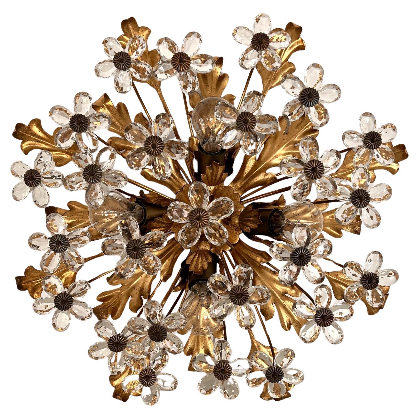 Gorgeous round shaped flush mount light made of long golden metal leaves and many cascading Murano glass flowers.
Hand crafted by Banci Florence.
The Murano glass flowers are arranged cascading downwards and are beautiful to look at, especially when