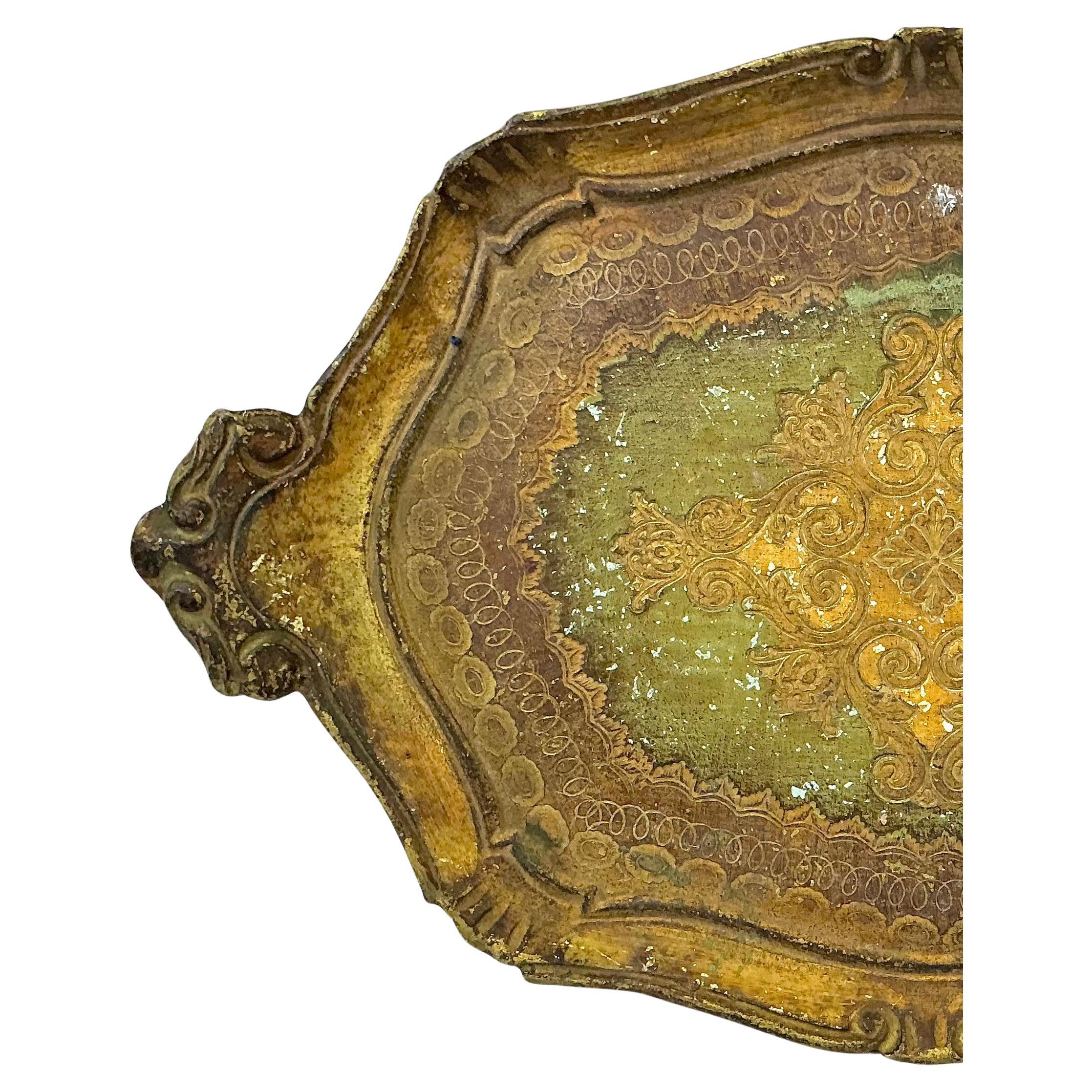 Charming Mid-20th Century Italian Florentine Wooden Tray, hand-painted and gilded. This tray showcases the traditional craftsmanship of Florence, where artisans perfected the art of hand-gilding and painted decoration on wood. The scrolled edges are