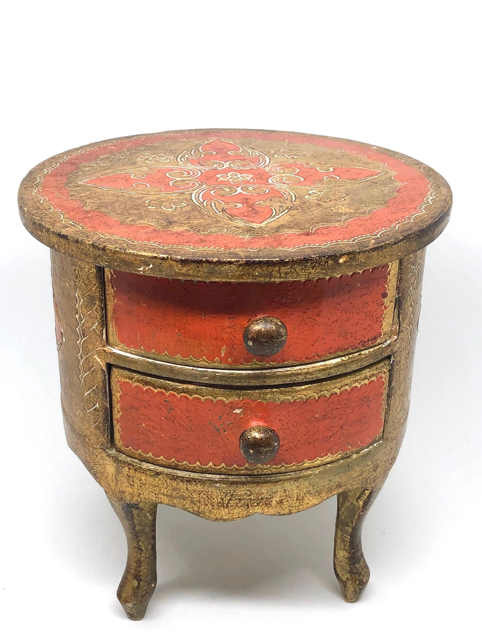 Offered is an absolutely stunning, 1950s Italian giltwood jewelry box in the design of a chest of drawers. Minor patina and paint lost gives this piece a classy statement.