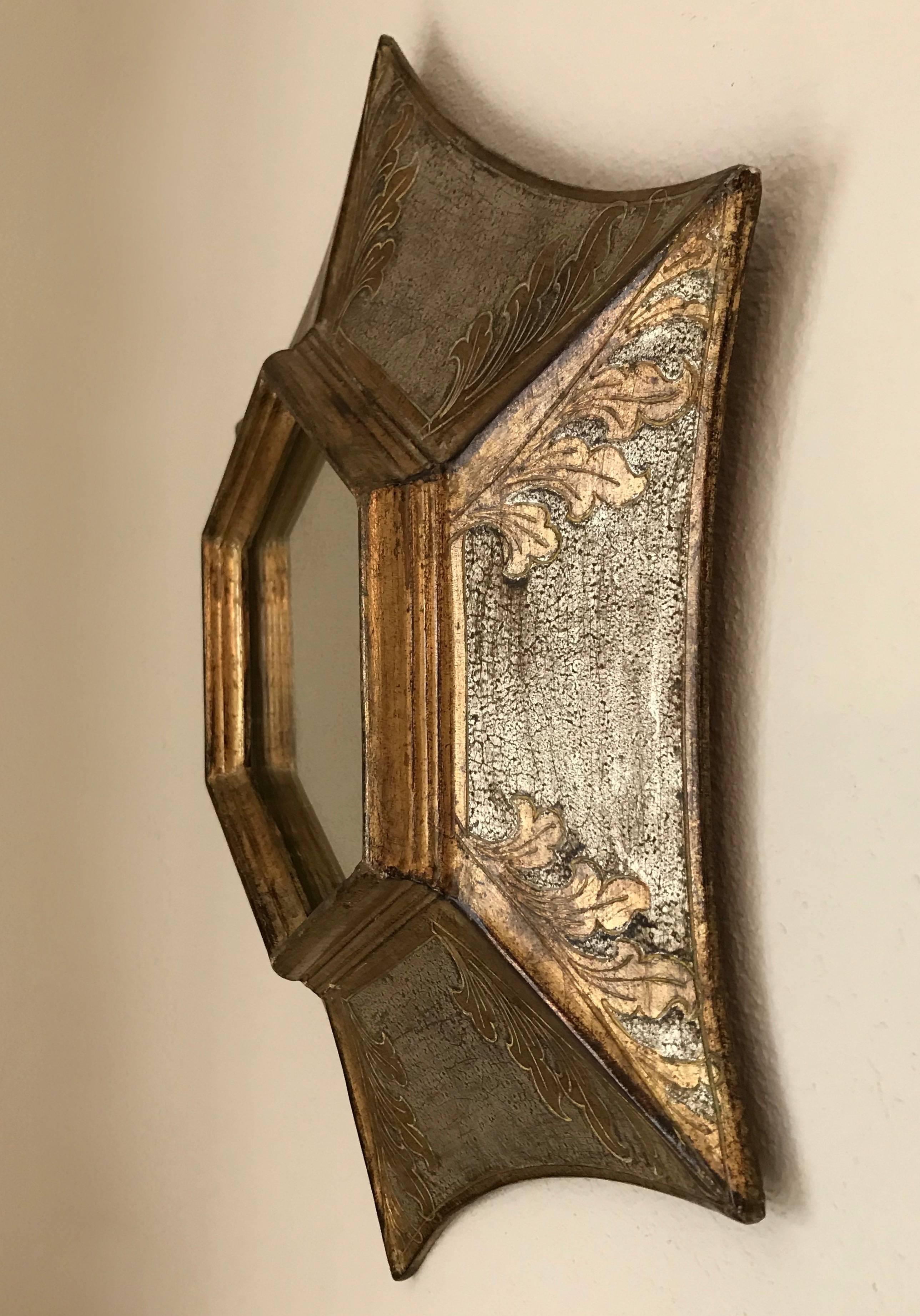 Handcrafted giltwood soleil or sunburst mirror crafted in Florence, Italy. Incised acanthus leaf motif with gold and silver leaf in an antiqued finished. Light gold specking to the back of silvered backing of inset mirror.

Measures: 19.25