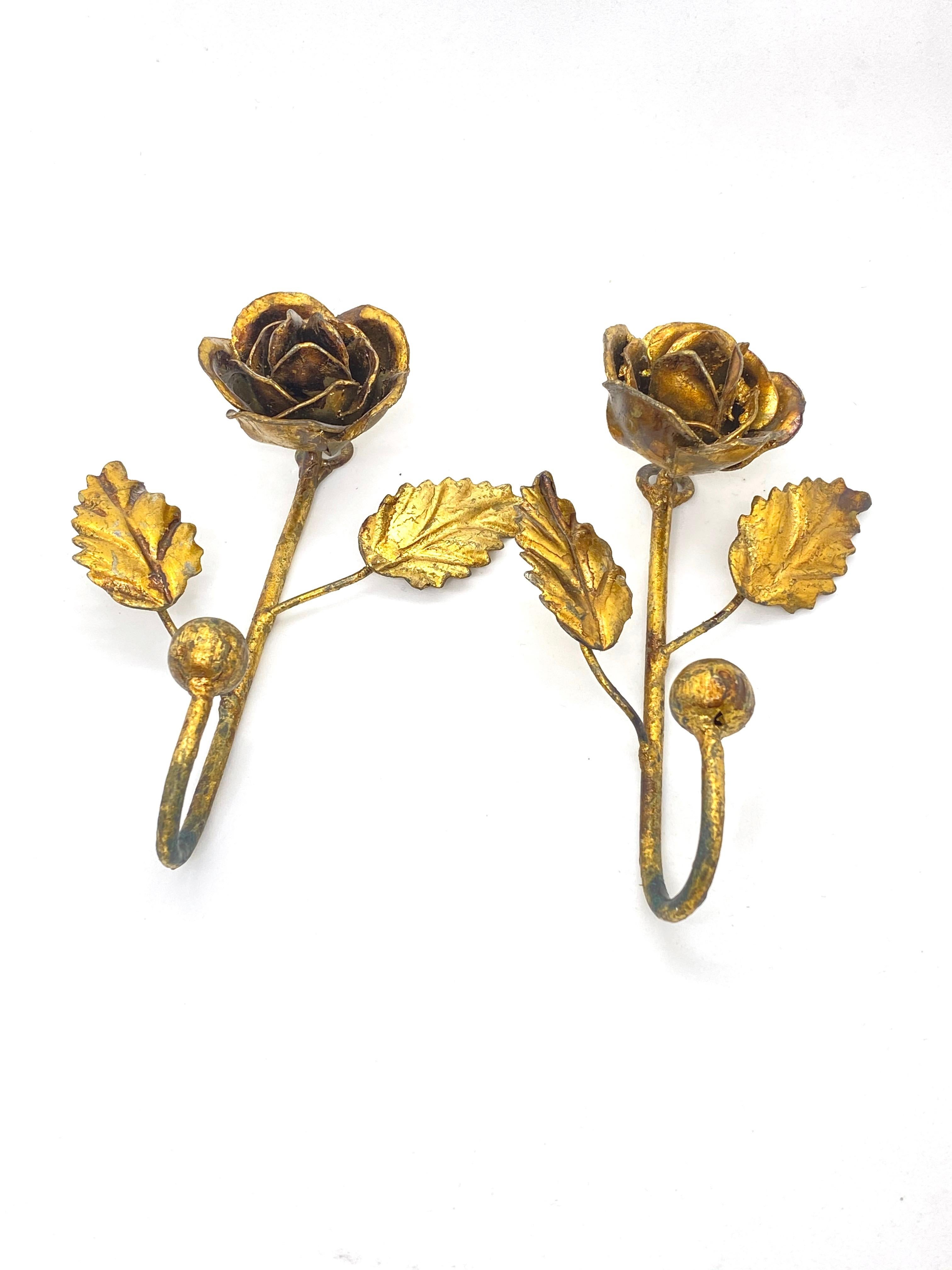 Offered is an absolutely stunning, 1950s Italian gilt metal coat hook set for your hall entry. Minor patina and paint lost gives these pieces a classy statement.