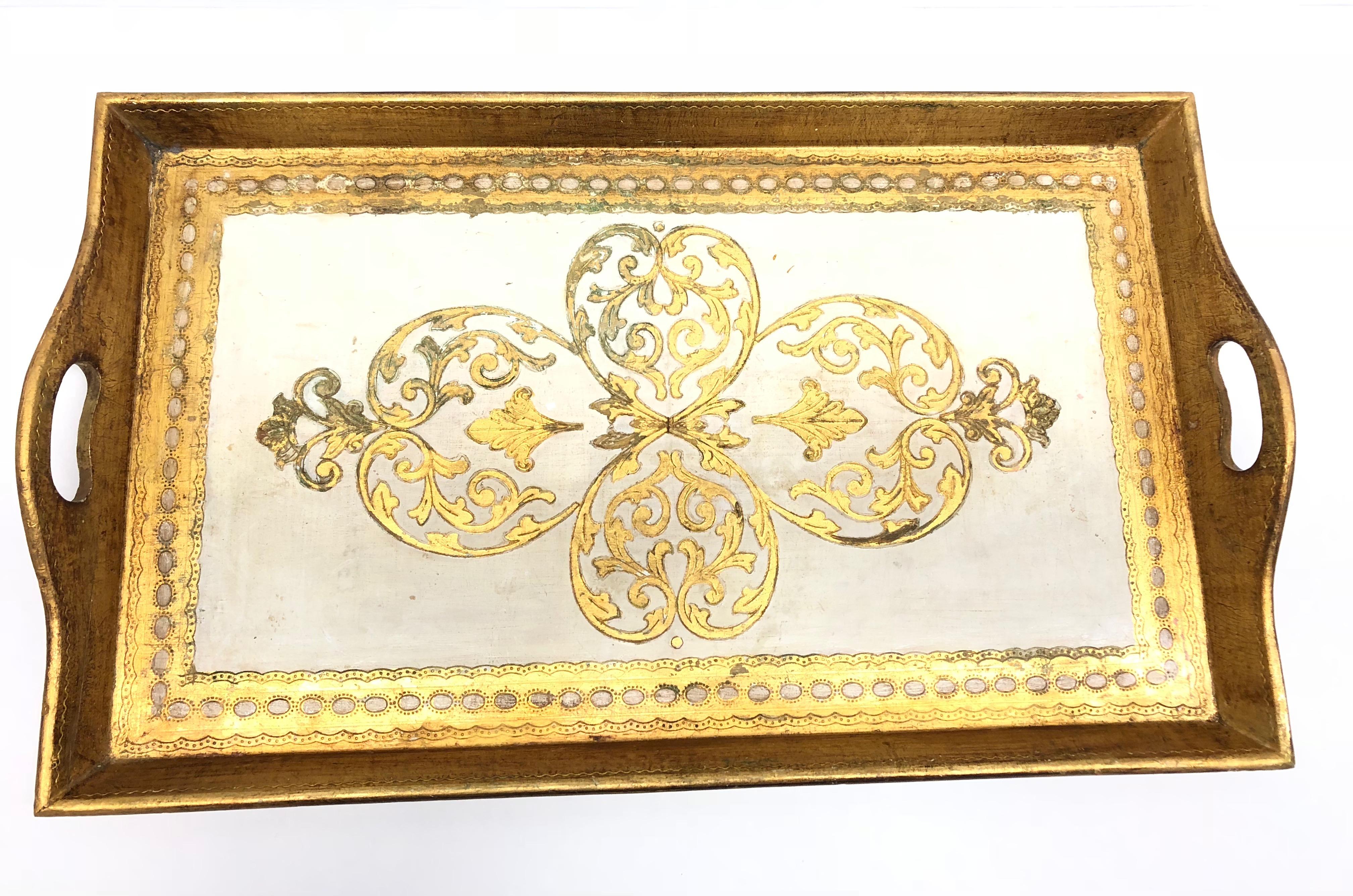 Offered is an absolutely stunning, 1950s Italian giltwood serving dresser tray. Minor patina and paint lost gives this piece a classy statement.