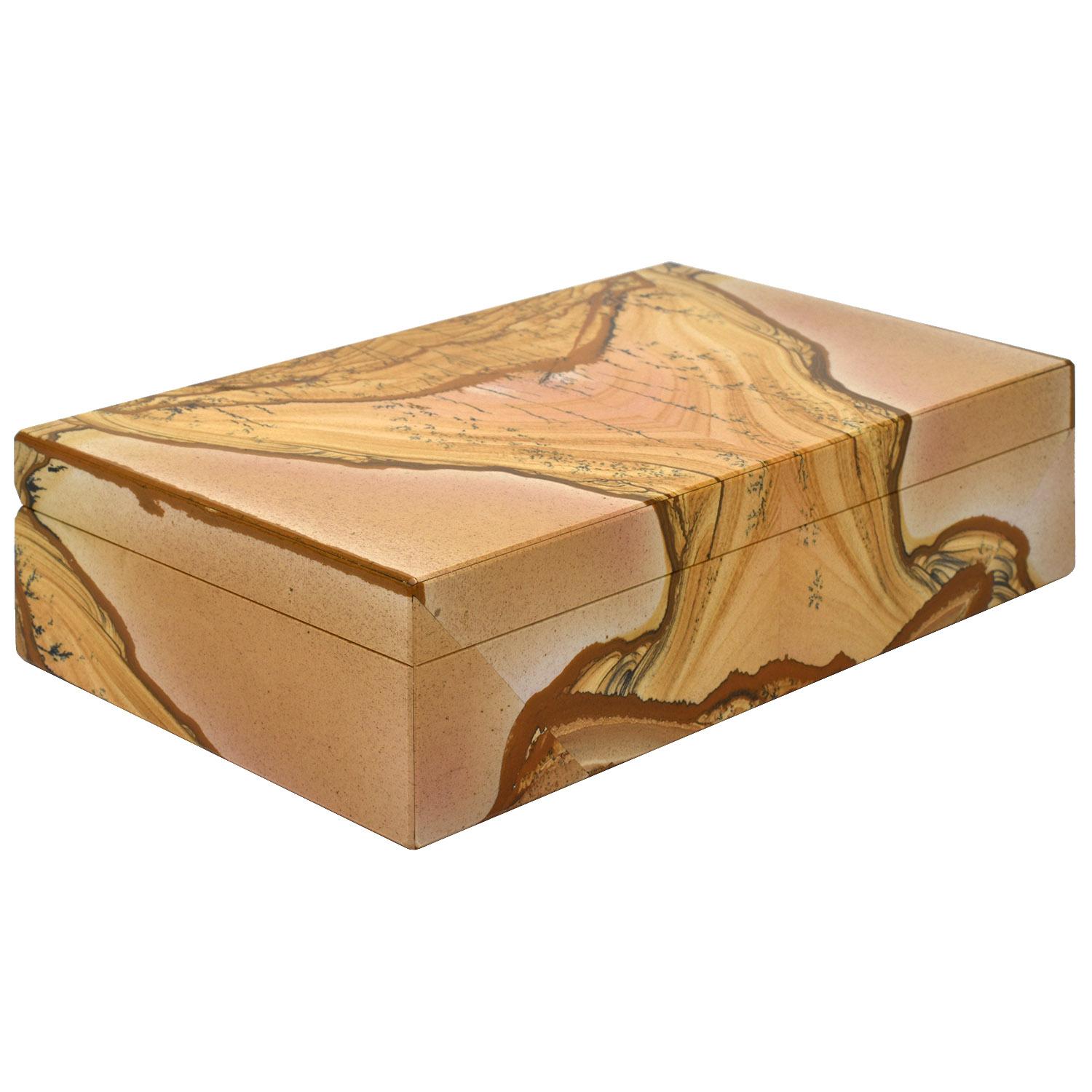 Italian Florentine marble Pietra Paesina natural stone box with onyx interior

This exquisitely made natural mineral specimen box features Florentine marble which is a rare kind of limestone called pieta paesina. The stone falls into the picture