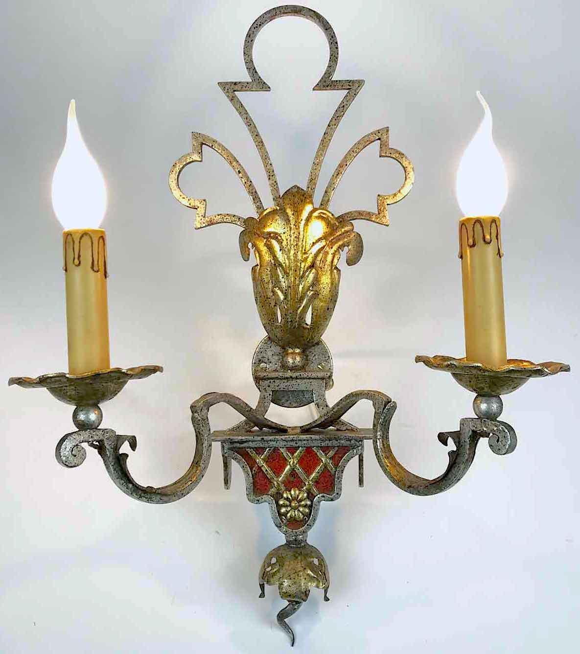 Late 20th century Italian iron sconces, a pair of silver-leaf and partially gilt two-light sconces by Banci, manufactured by Banci Firenze in the Renaissance style, decorated with red accents and geometrical stylized pattern in the lower part