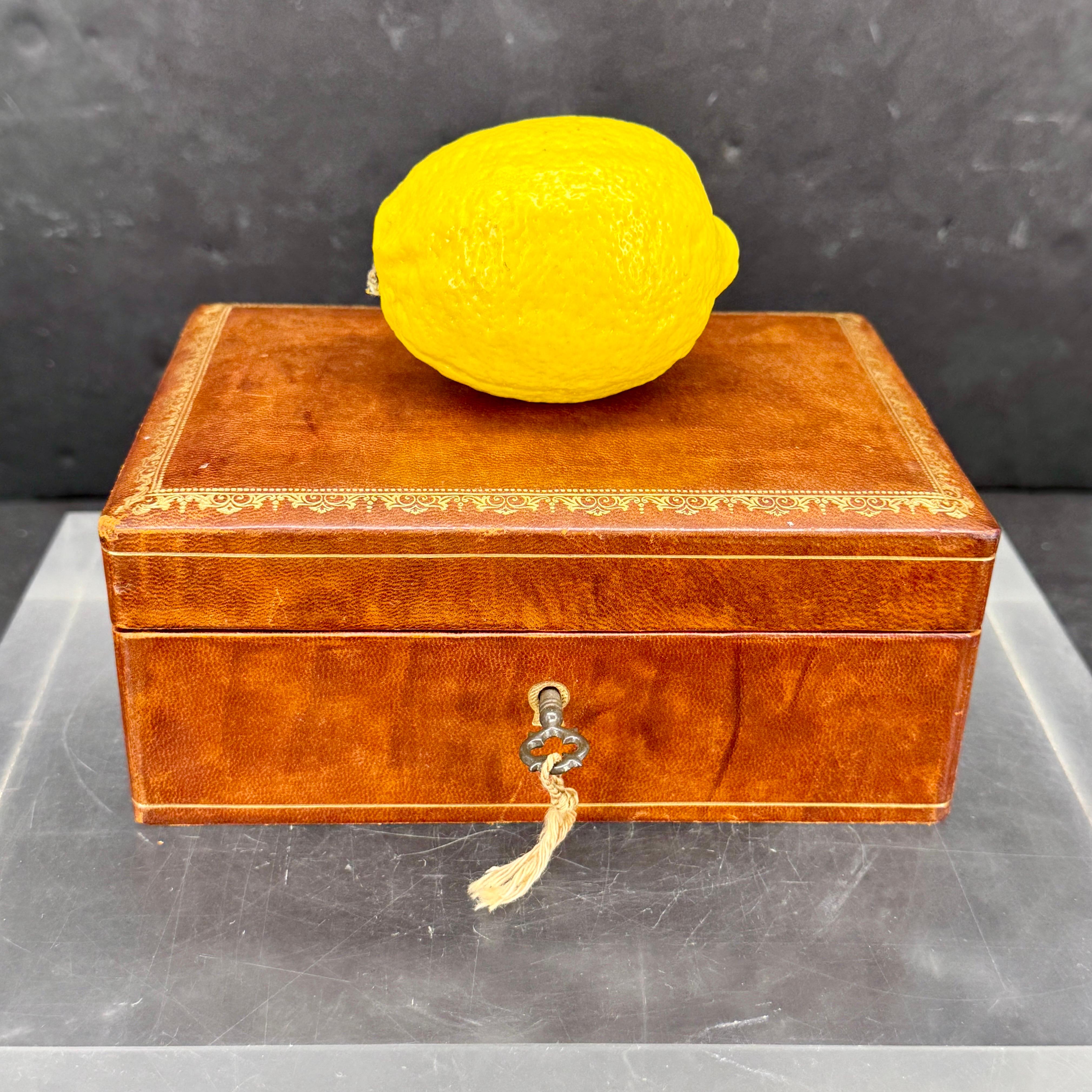 We are always on the hunt for these vintage Florentine boxes and rarely we come across one with a lock and a key. This Italian rectangular box, lined in yellow velvet, is prefect to store your favorite jewels or trinkets. Great piece sitting on a