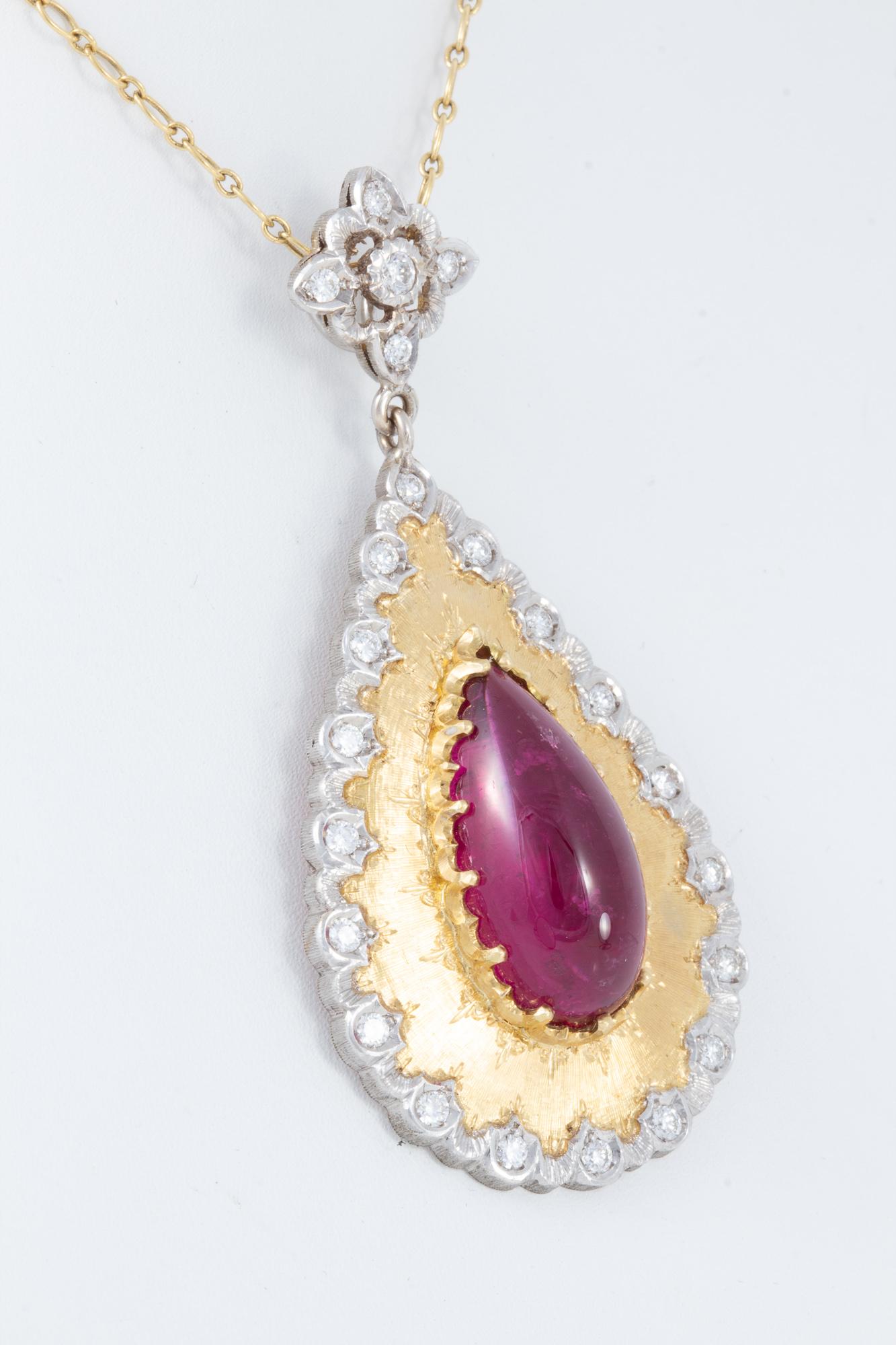 Beautifully handcrafted pendant featuring 14.6 carat Rubellite Tourmaline.  Exceptionally clean stone with near perfect color,  the Tourmaline is surrounded by  .78 carats of F/G VS1 diamonds.Handcrafted by a small family run studio in Florence,