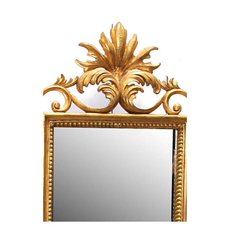 Impressive late 19th century Italian Florentine style carved giltwood mirror.

The mirror is surmounted by a foliate palmette over a rectangular mirror plate surrounded by gilt scrolling acanthus leaves and foliage motifs.