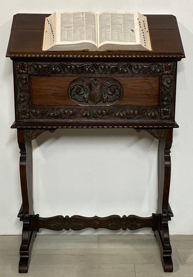 A 16th century Florentine style, podium height drop front desk. Beautifully carved solid walnut, having a fitted interior, and 32 inch writing surface when open. 
Italian, early 20th century, circa 1920.