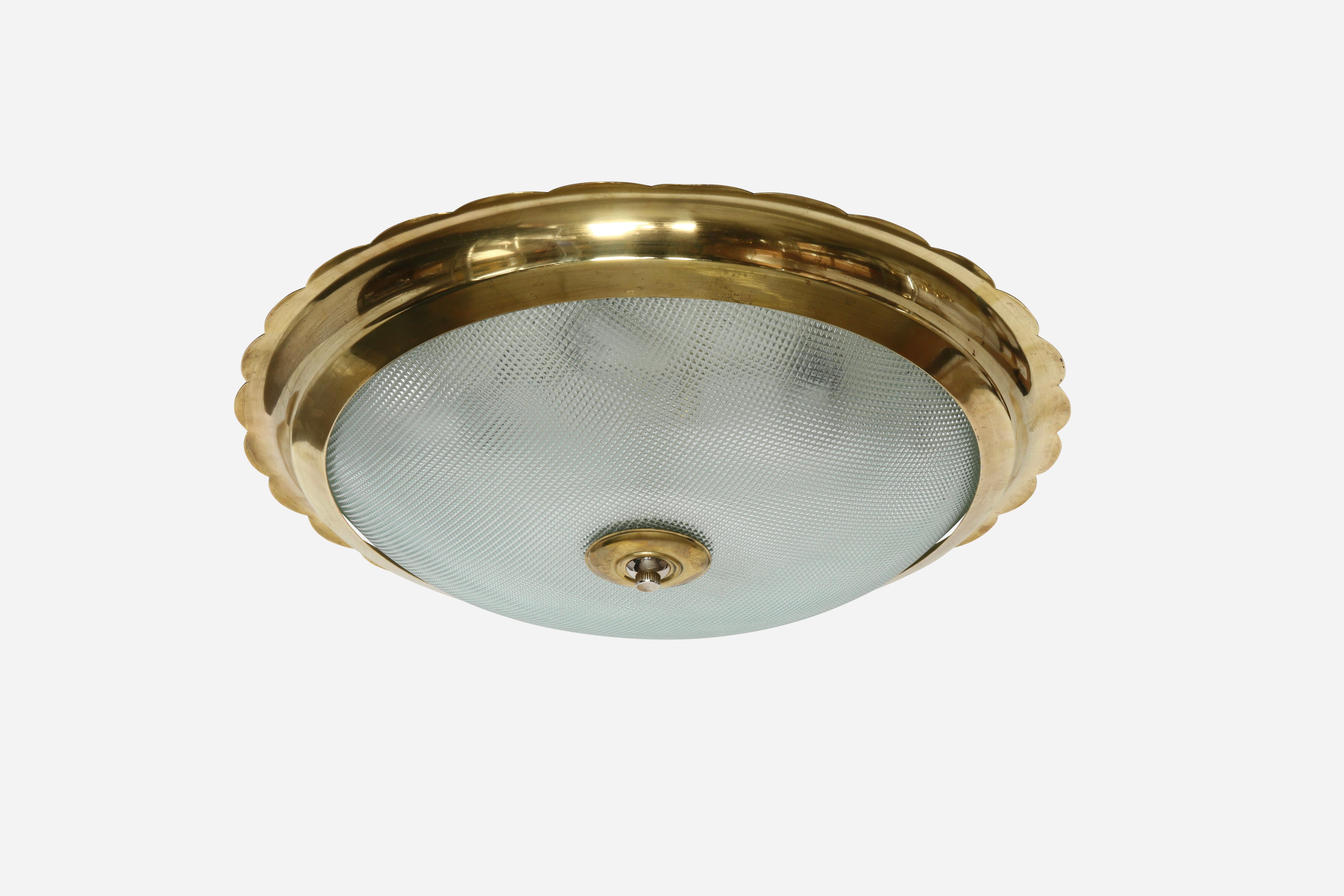 Italian flush mount ceiling light, large
Designed and made in Italy in 1960s.
Textured glass, scalloped brass frame.
Takes 7 candelabra bulbs.
Complimentary US rewiring upon request.
