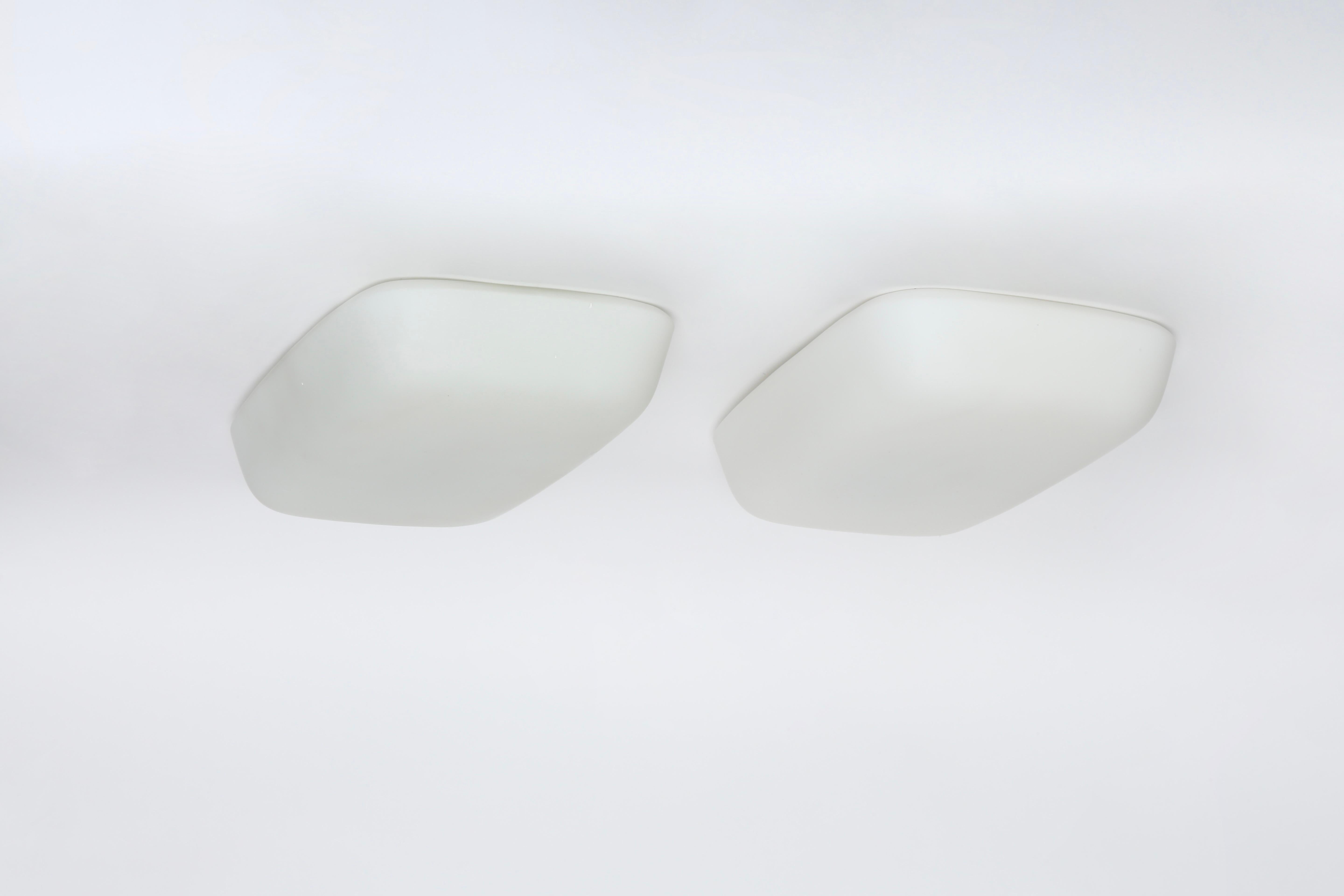 Italian flush mount ceiling lights, set of 2.
Designed and made in Italy 1960s.
Opaline glass, aluminum.
Lights take 1 medium bulbs each.
Complimentary US rewiring upon request.
Sold and priced as a set of 2.

We take pride in bringing vintage