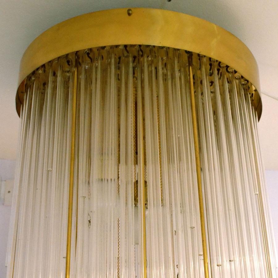 Spectacular Mid-Century Modern tier glass and brass flush mount chandelier is like a waterfall in the style of Sciolari, original 1960s Italian. The stylish brass border holds a frame of which 250 strands of cascading glass and brass hanging in