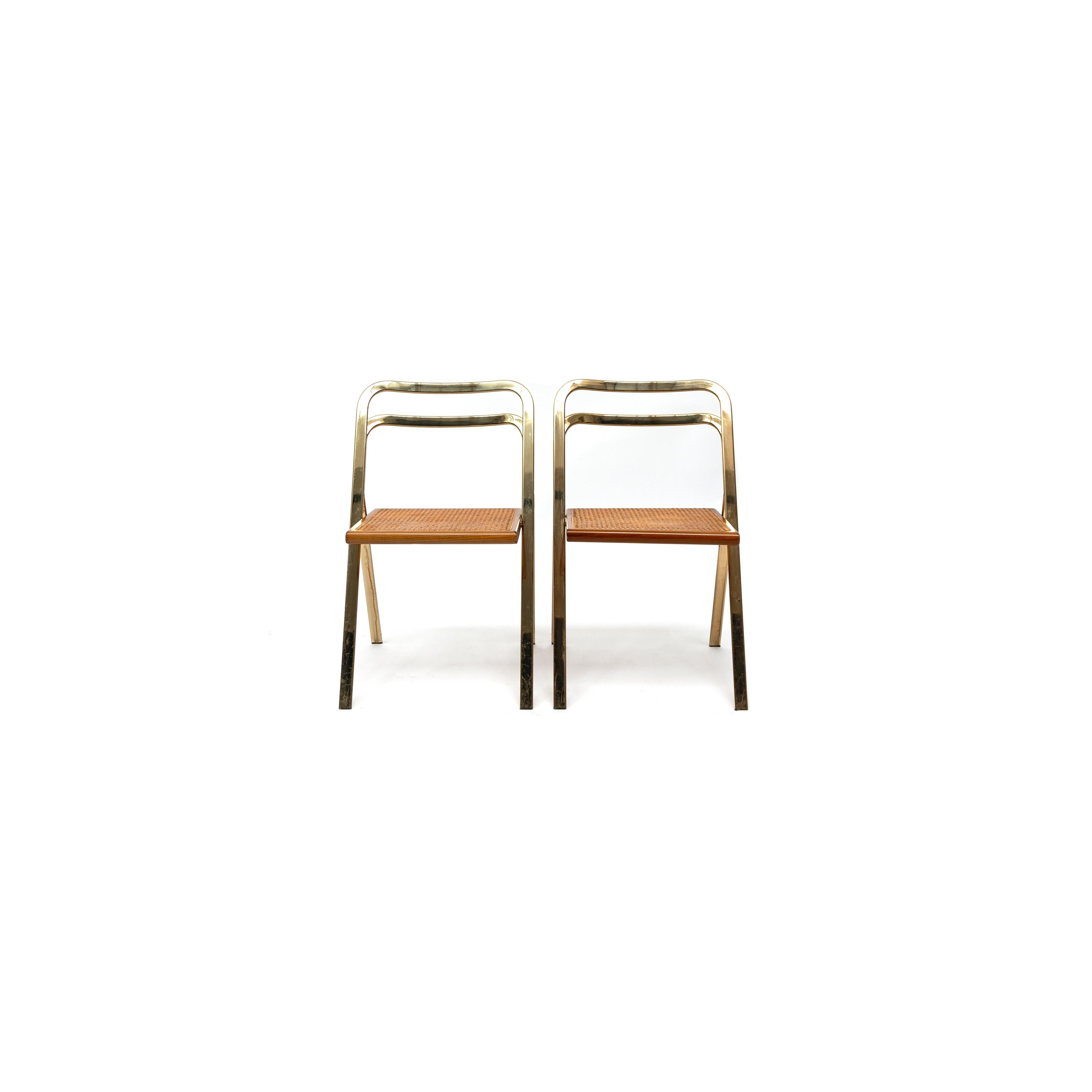Set of 2 folding chairs by Giorgio Catellan for Cidue, Italy, 1970. These chairs are a beautiful shaped design pattern model, very elegant and functional. They fit together in each other very efficiently. They have been manufactured by Cidue,