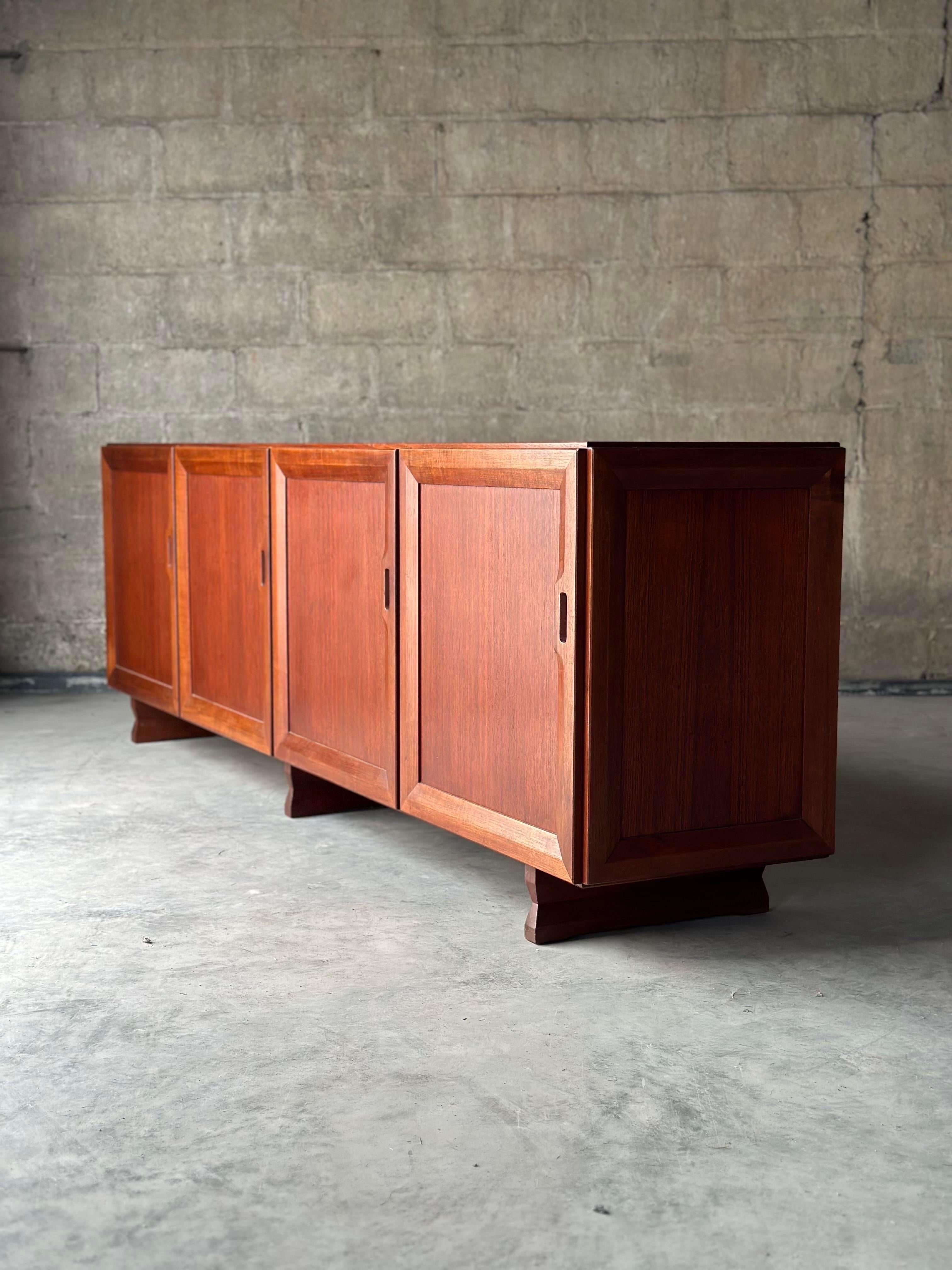 An Italian model MB 51 sideboard designed by Franco Albini for Poggi. Made of solid teak with a minimalist design and sharp lines.