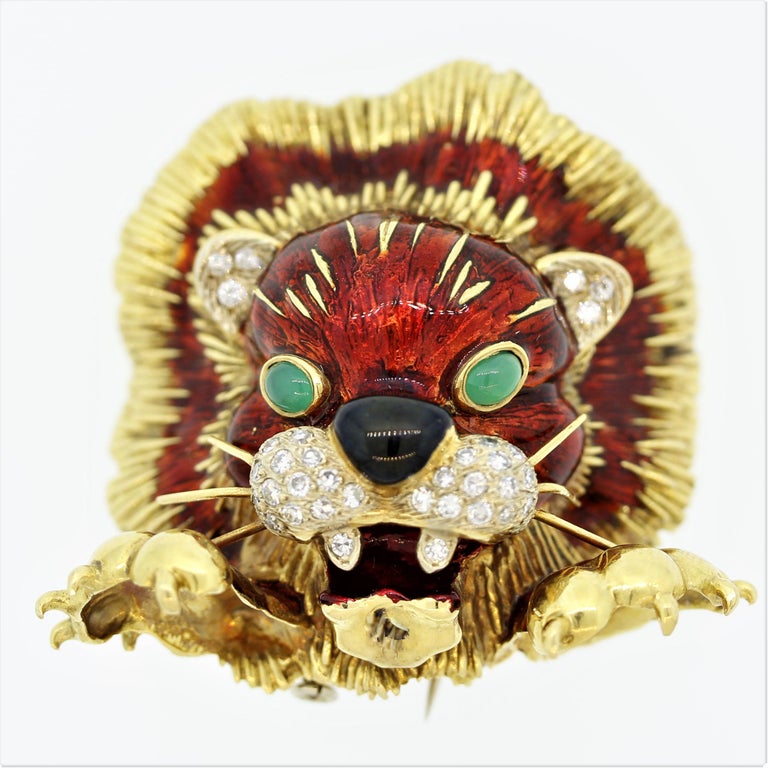 Fierce yet still cute! This baby lion made in Italy by designer Frascarolo features round brilliant cut diamonds set on the lion’s face, teeth and ears. Bright red enamel is hand painted on its head and mane. A piece of black onyx makes its nose