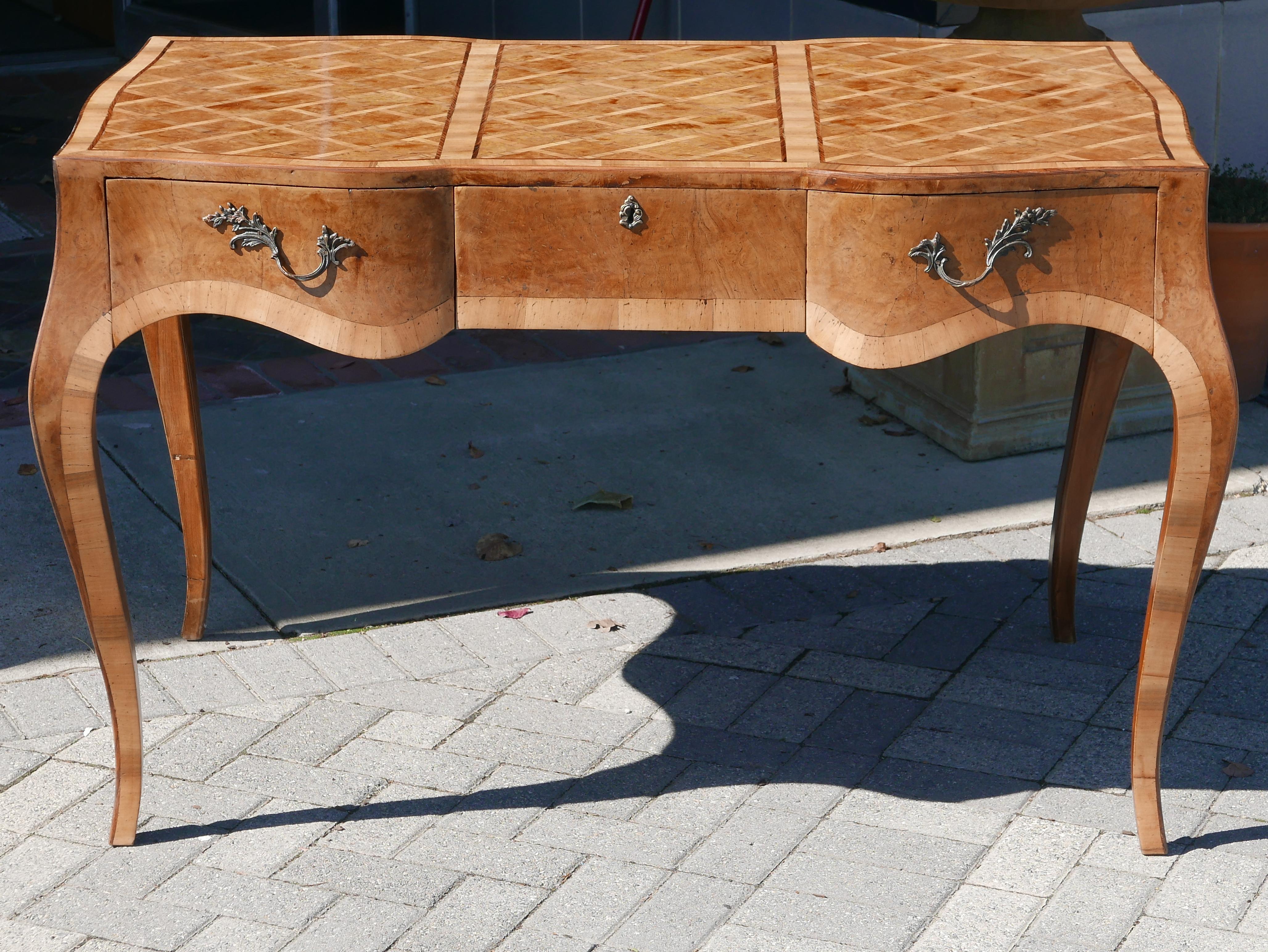 Stunning sculptural fruitwood and burl marquetry desk done in a parquet pattern, stunning bombe shape with cabriole legs. Total refinished and ready to go.