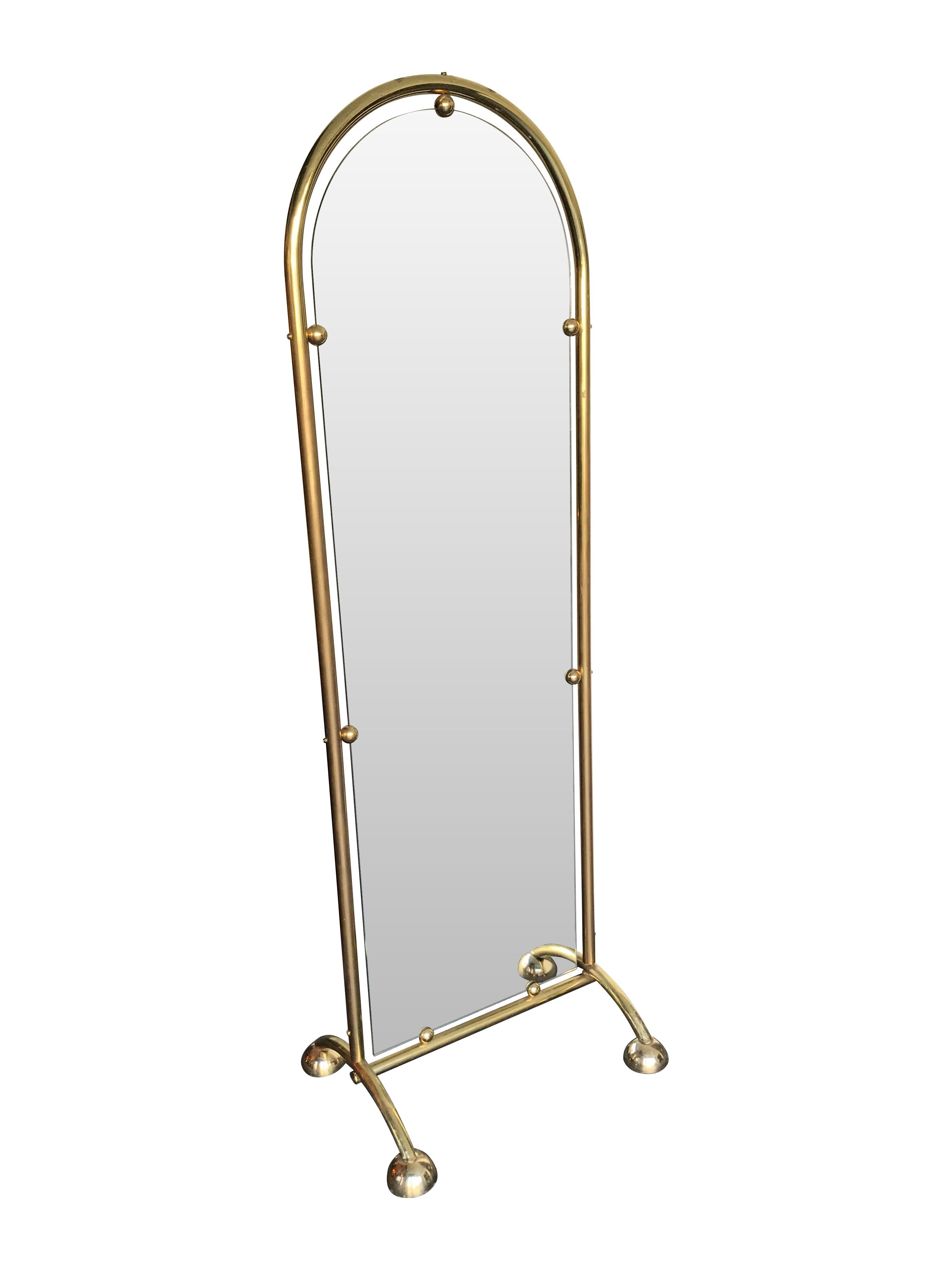 An Italian double sided full length tailors mirror with brass frame and splayed feet each with castors under the domed feet. The mirror floats inside the brass frame and fixed at seven points around the outside.