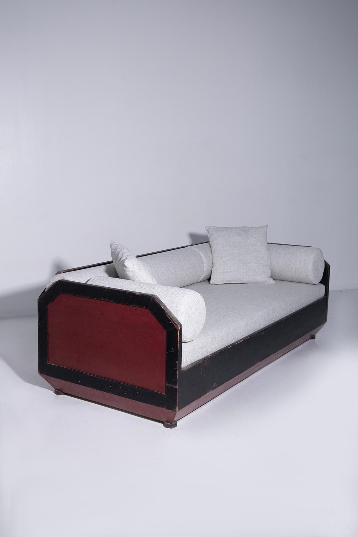 Enter a world of artistic innovation and respect for history with this extraordinary Italian sofa from the Futurist era, dating back to the dynamic period between 1910 and 1915. This sofa is not just a piece of furniture, but embodies a