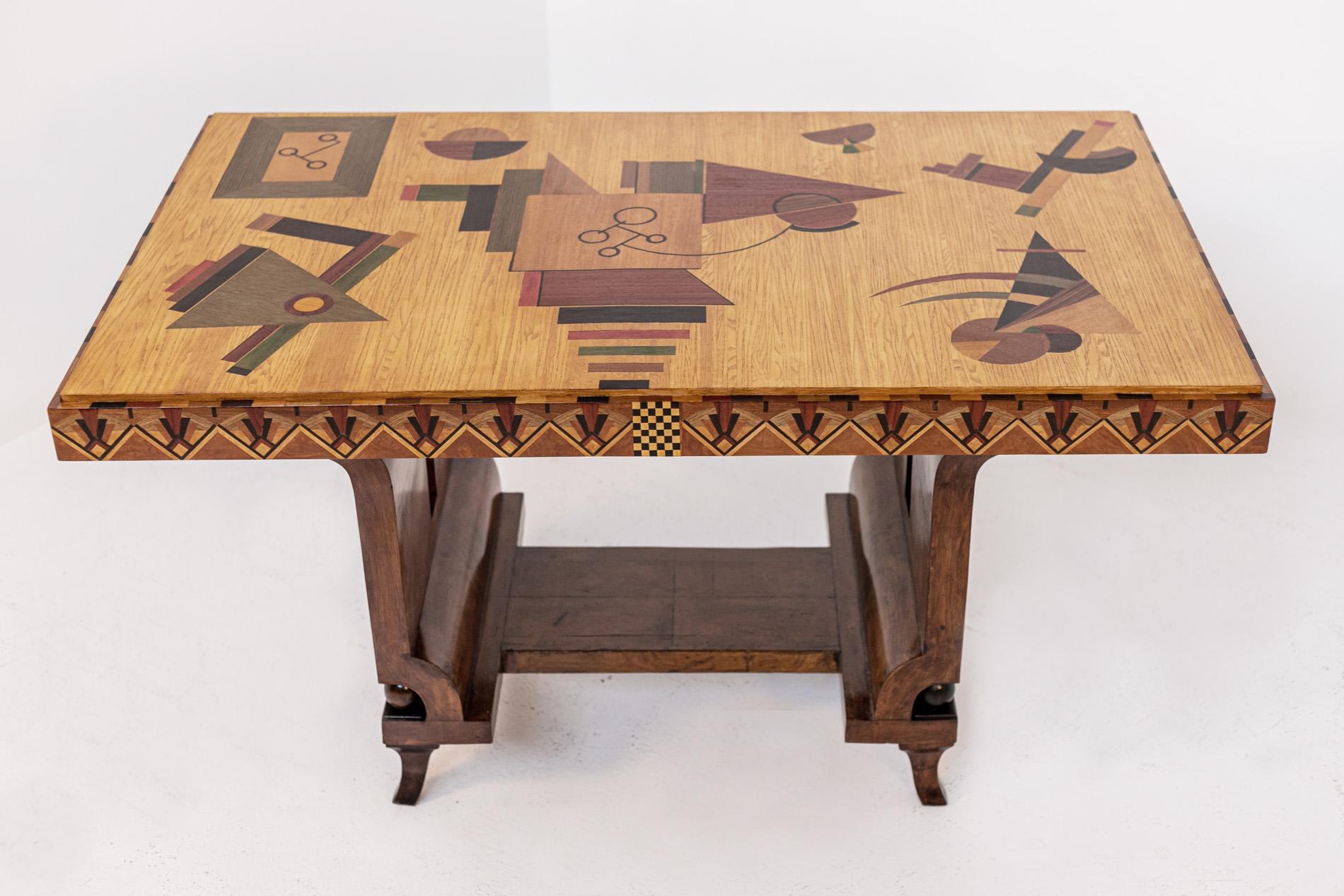 This stunning table by Italian artist Mauro Varotti from the 2000s is inspired by the work of futurist artist Fortunato Depero and his dynamic creations. The simple structure, is made of honeycomb wood and fully decorated with a series of inlays