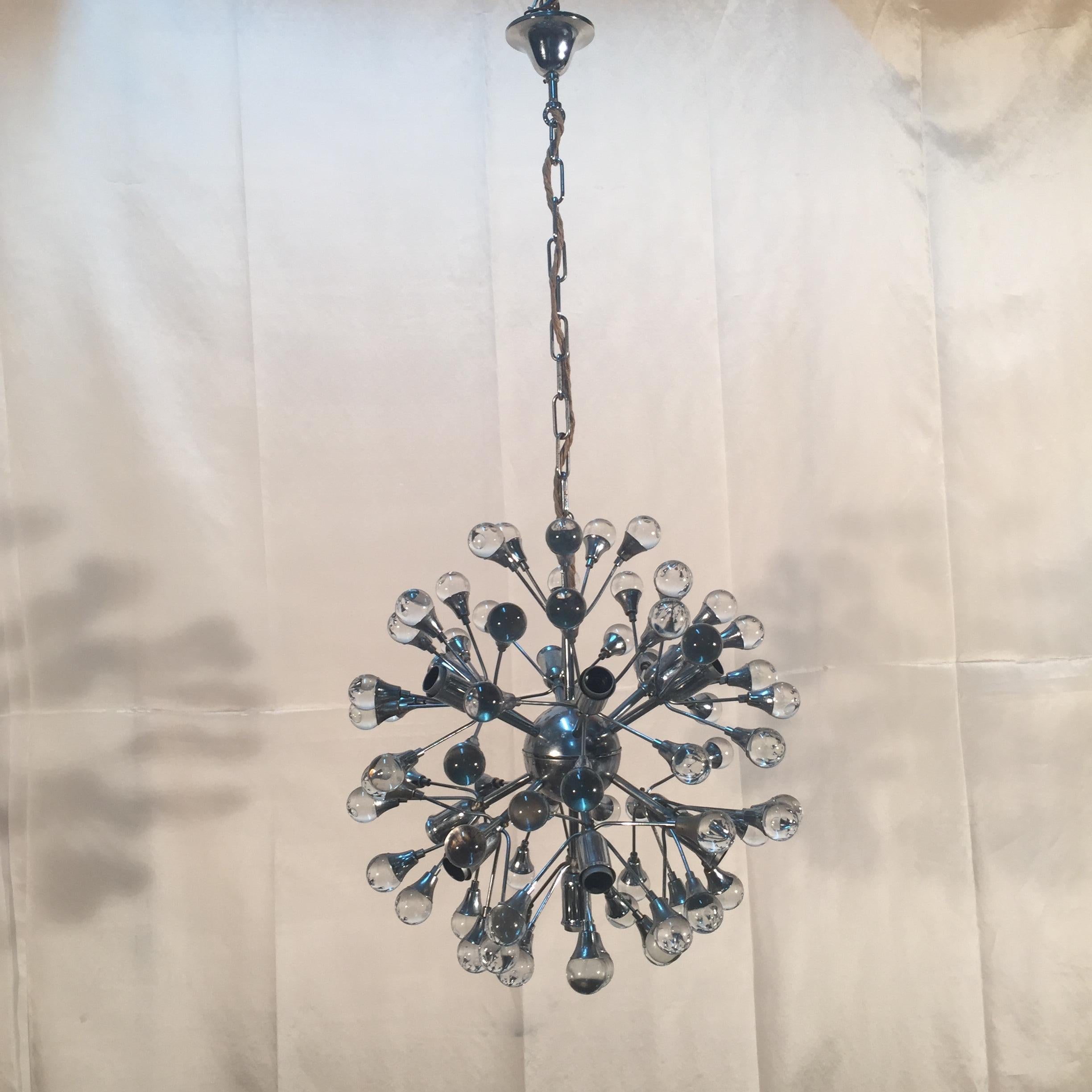 Glass and chrome chandelier produced by Gaetano Sciolari during the 1960s. It is in excellent vintage condition.