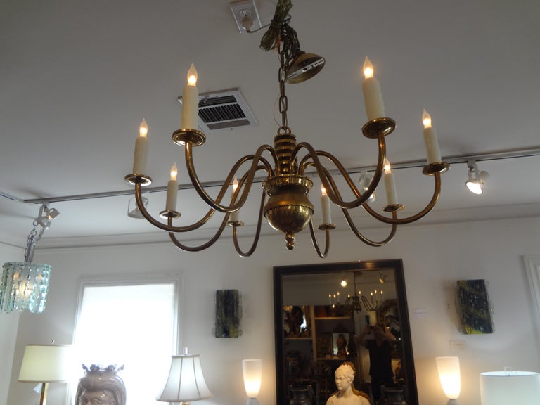 Great Italian Mid-Century Modern Gaetano Sciolari inspired geometric eight-light brass chandelier. This beautiful Italian brass geometric chandelier has been newly wired with new sockets and candle sleeves. Our brass chandelier is perfect for lower