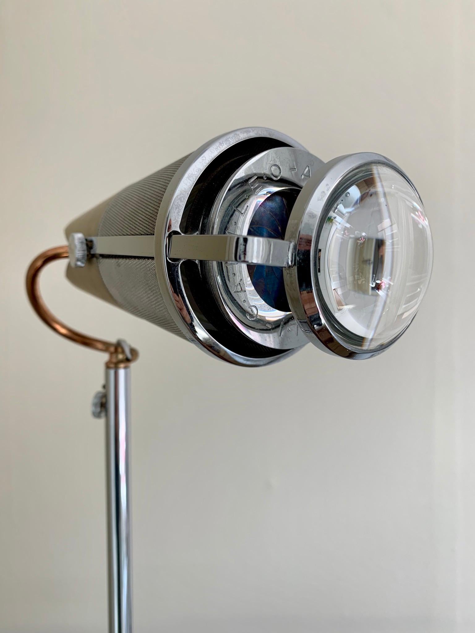 Designed by Arturo Silva for Antonangeli in Milan, circa 1980s. Very unusual lens design complete with zoom able magnifying lens and built in diaphragm. This mechanism allows the light to be dimmable.
The bulb is halogen but can be changed for an