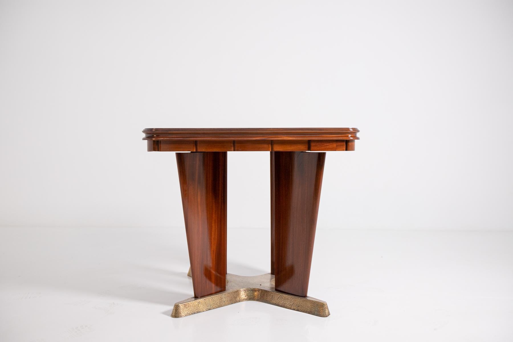 Elegant and refined game table by Giorgio Ramponi from 1950. The table is made of walnut wood and brass. The game table comes from a private Bolognese house. The game table has several peculiarities, one of which is its brass base worked by hand.