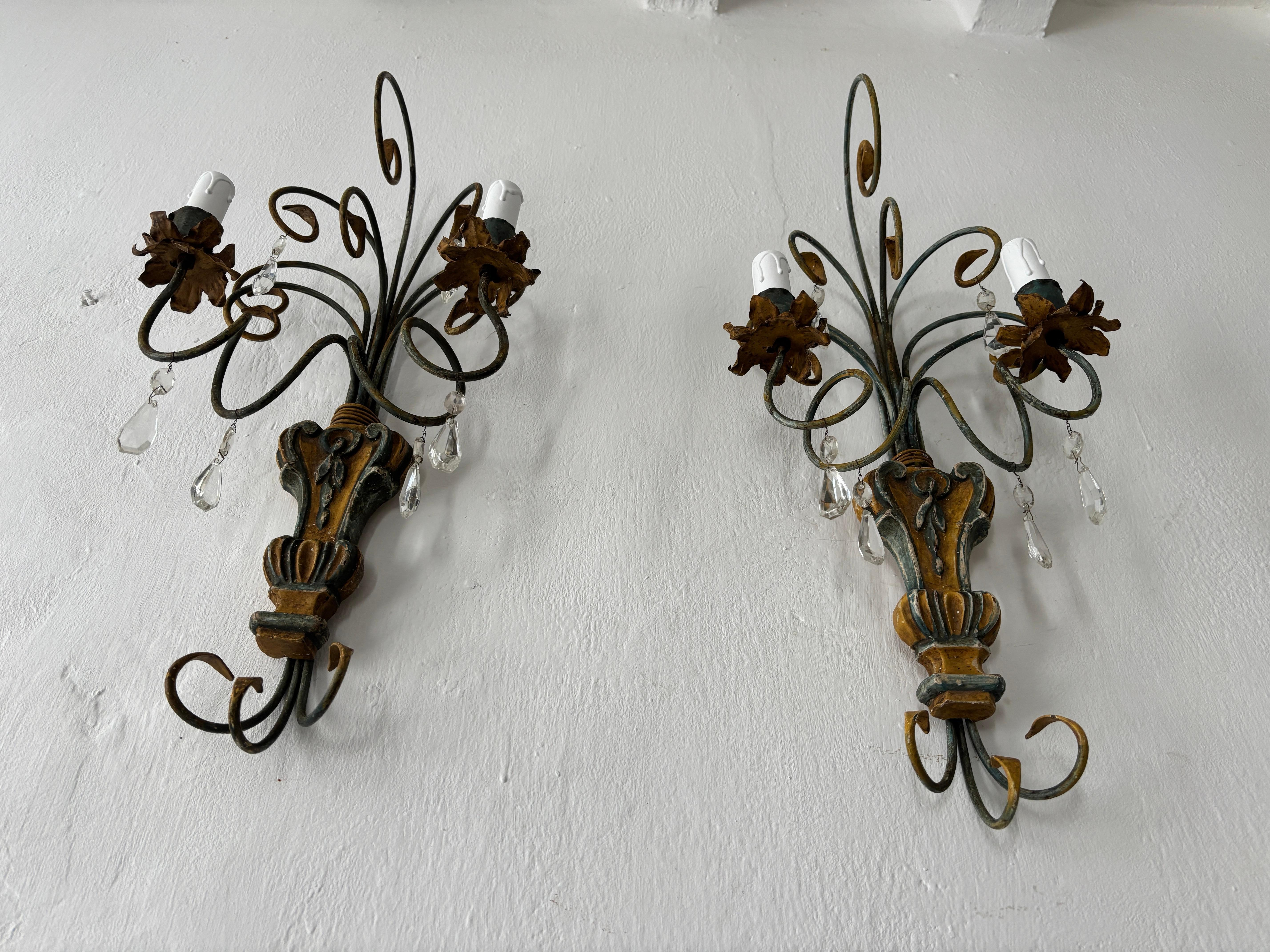Housing 2-light each. Will be newly rewired with certified US UL sockets for the USA and appropriate sockets for all other countries and ready to hang. Metal scrolls in original mustard yellow and blue green.  Hand carved wood with metal bulb