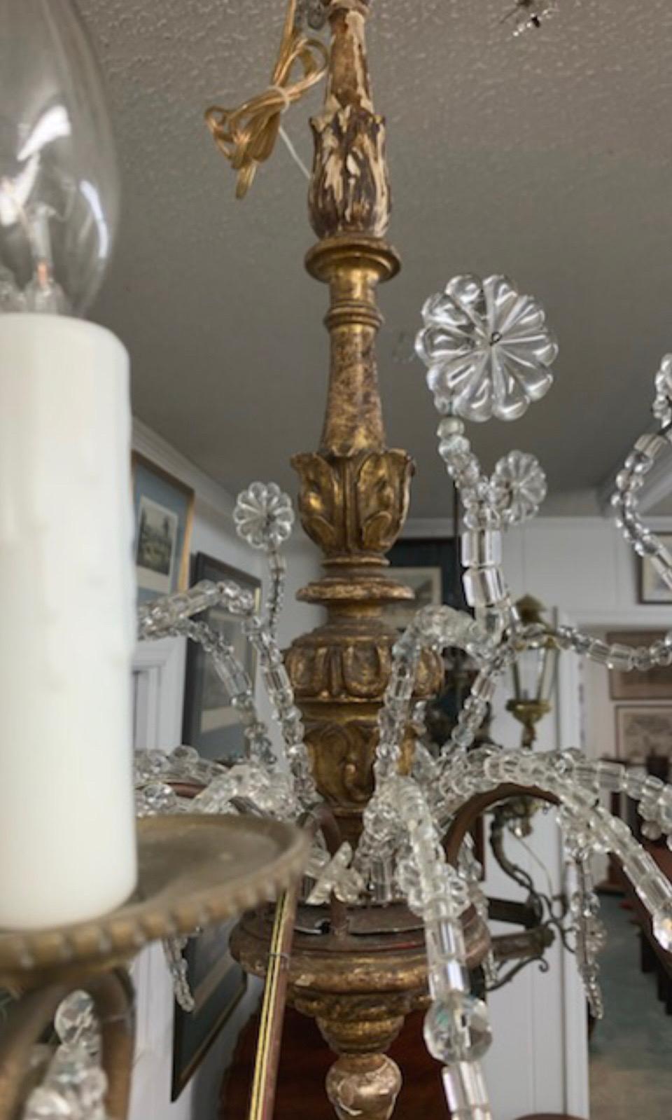 Araña italiana genovesa, madera dorada, hierro forjado y cristal Bronce en venta