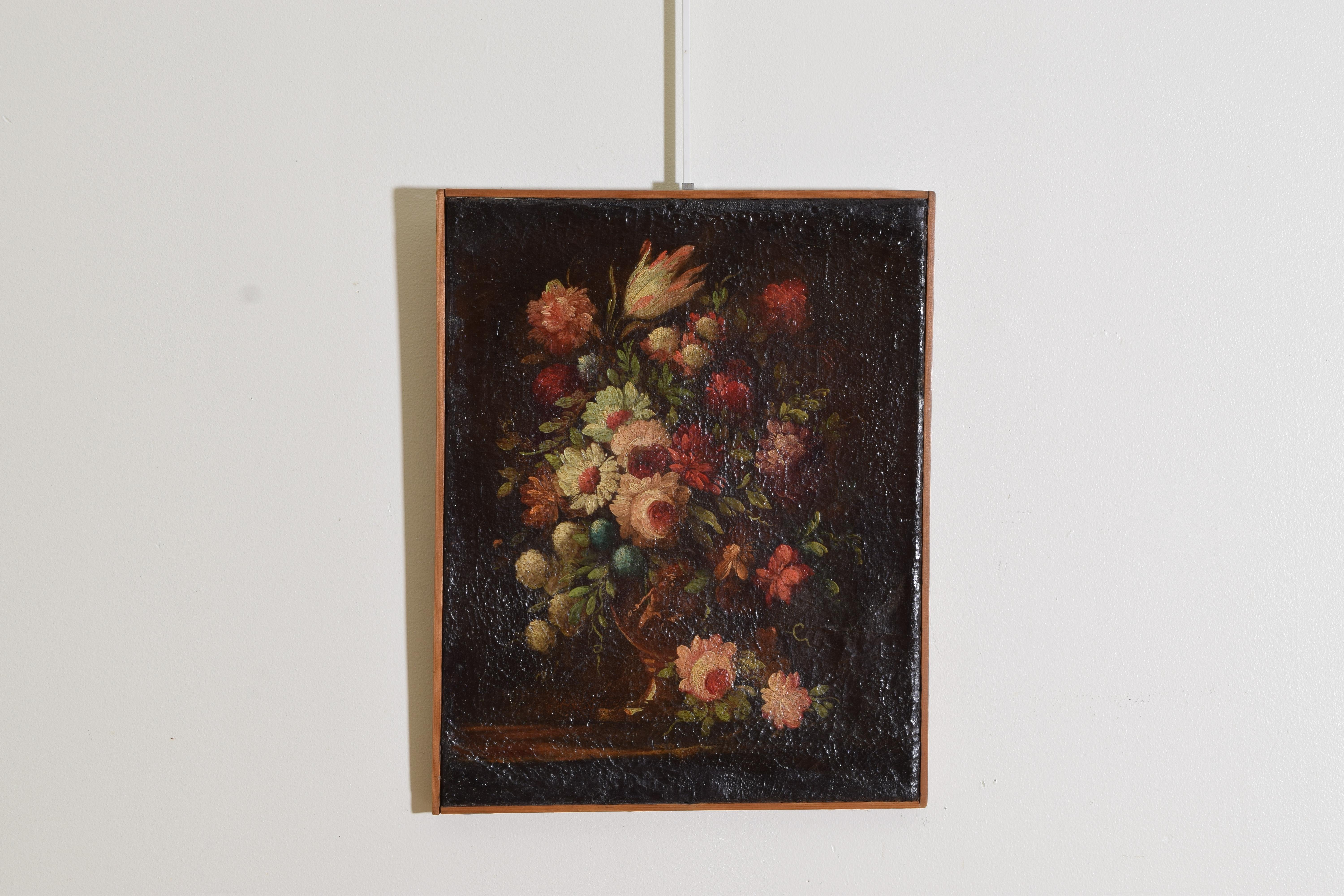 The floral bouquet a beautiful assortment of rich colors in a figural painted urn with a shadowy background, unframed