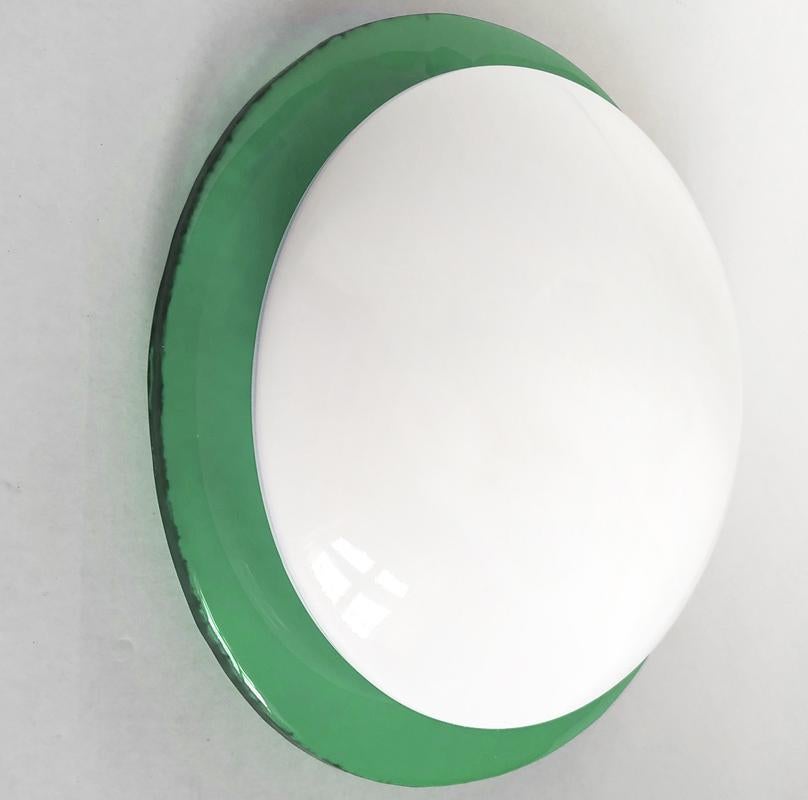 One of... round vintage Space Age hand blown Murano opal white and green textured glass wall or ceiling flush mount. 
The color of green textured glasses is not 100% identical.
Italy, 1970s-1980s.
Lamp socket: One E27 (US E26).

 
 