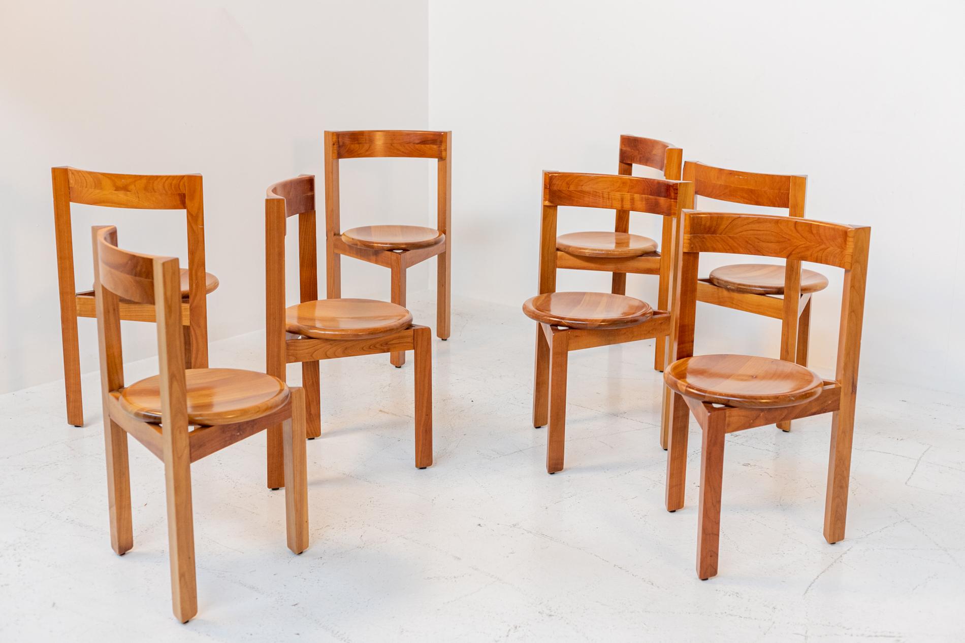 Geometric set of eight Italian chairs from the 1960s. The set from the lines and shapes seems to be post modern but it is from the 60's. The chairs are totally made of wood with excellent workmanship. The chairs enjoy a geometric line well defined