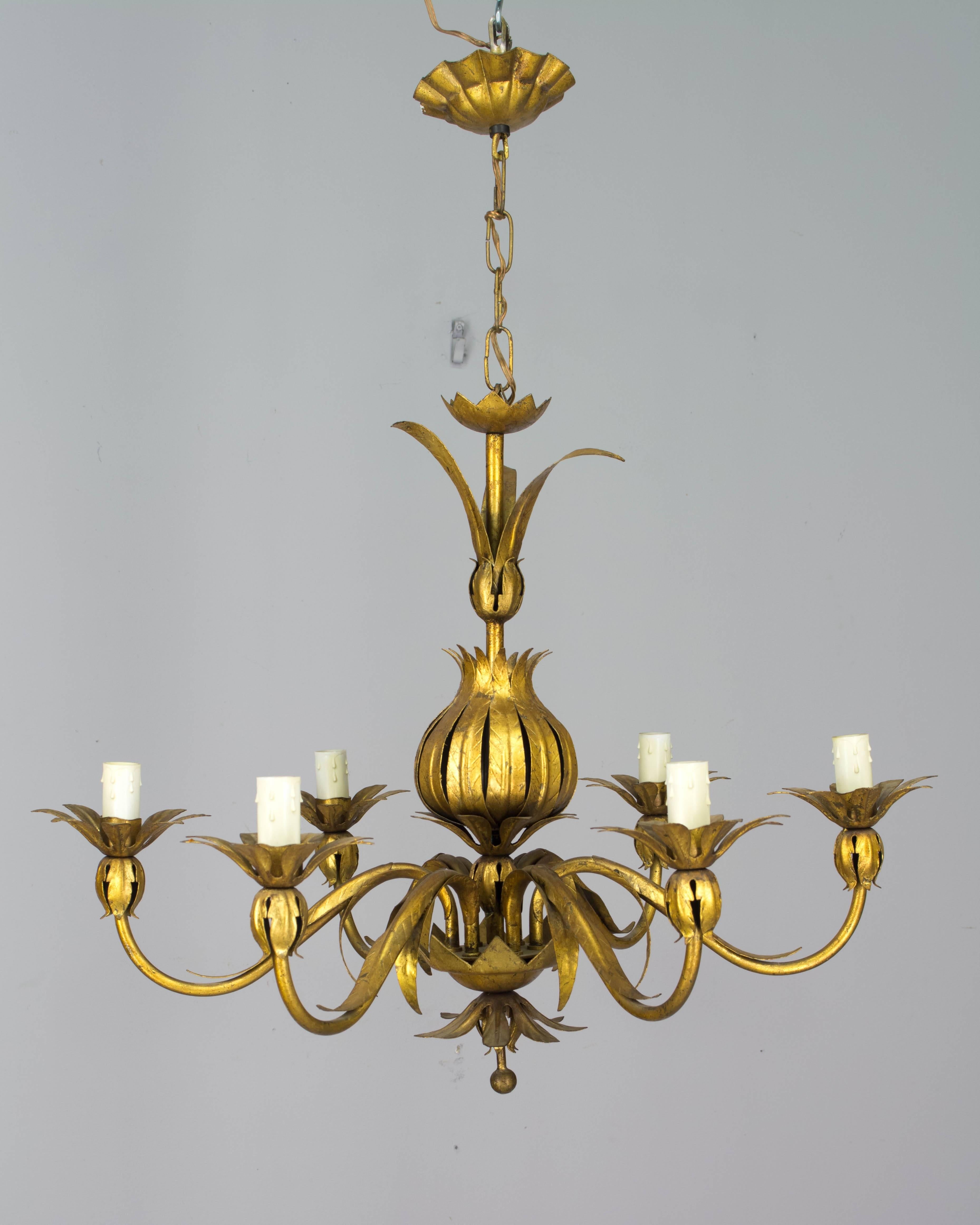 A Mid-Century Modern Italian gilded tole six-light chandelier. In very good condition with bright gilt. Original candle covers. Rewired with new sockets. Measures: 18
