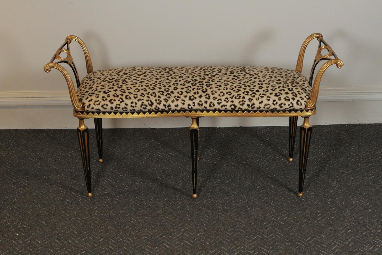 Italian gilt and painted Florentine style iron bench by Palladio with new leopard fabric
Dimensions: 48” W x 18” D x 25” H x 20” seat.