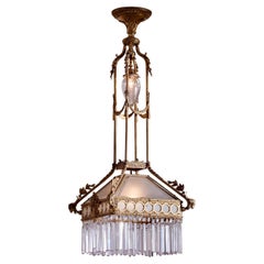 Antique Italian gilt bronze chandelier with glass and crystals from the 1920s