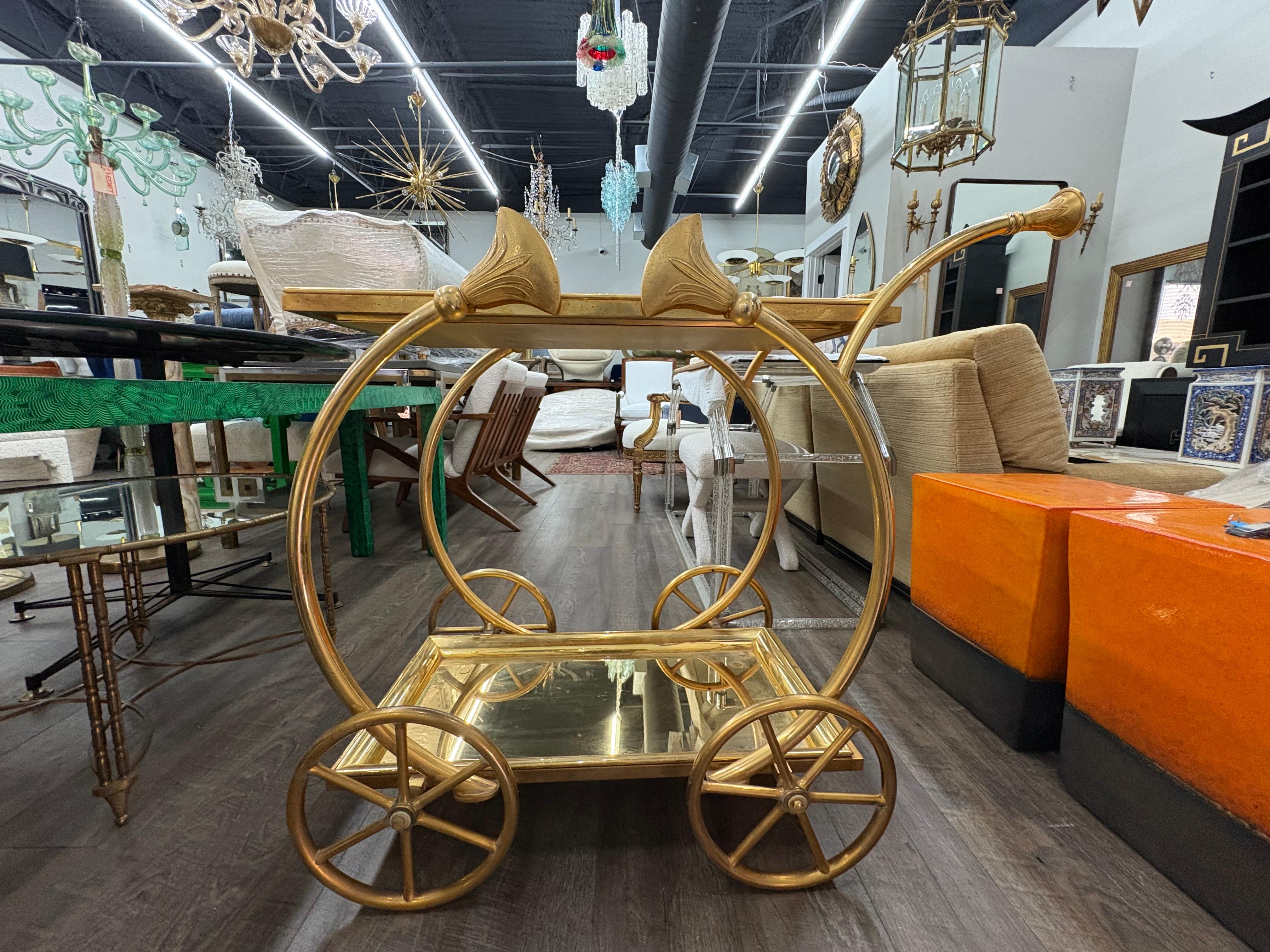 Italian Gilt Bronze Serving Cart.
Offered is an rare Italian Modern Louis XVI style gilt bronze serving cart, bar cart, drinks cart or tea cart. This cart, realized in the 1970's has a gorgeous details in a bright gilt bronze patina with two bronze