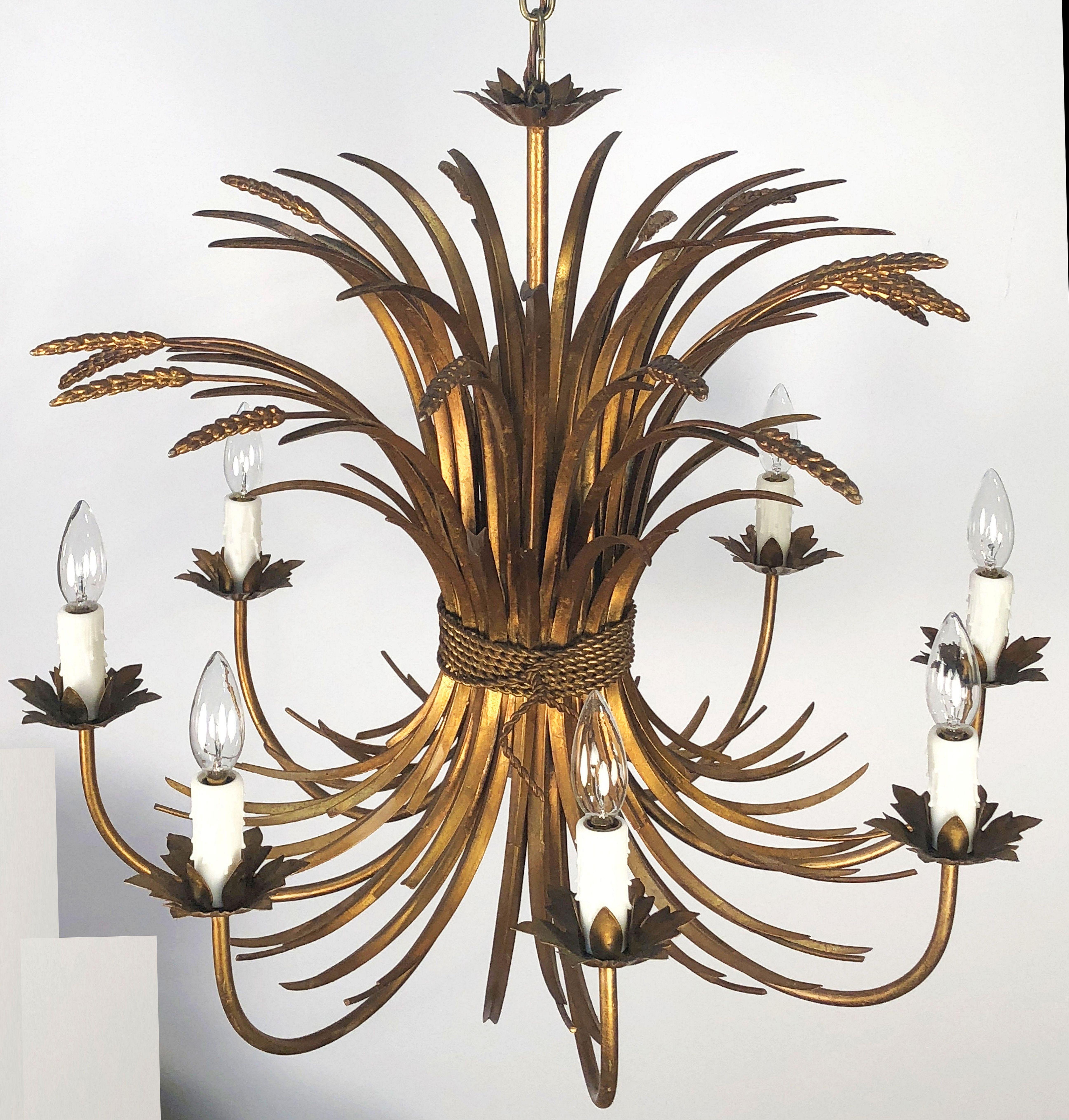 A handsome Italian eight-light hanging light fixture or chandelier or pendant light of gilt metal featuring a wheat sheaf (wheatsheaf) design, with floral bobeches and lovely foliate scroll accents.

Measures: 28 1/2 inches diameter

U.S. wired,