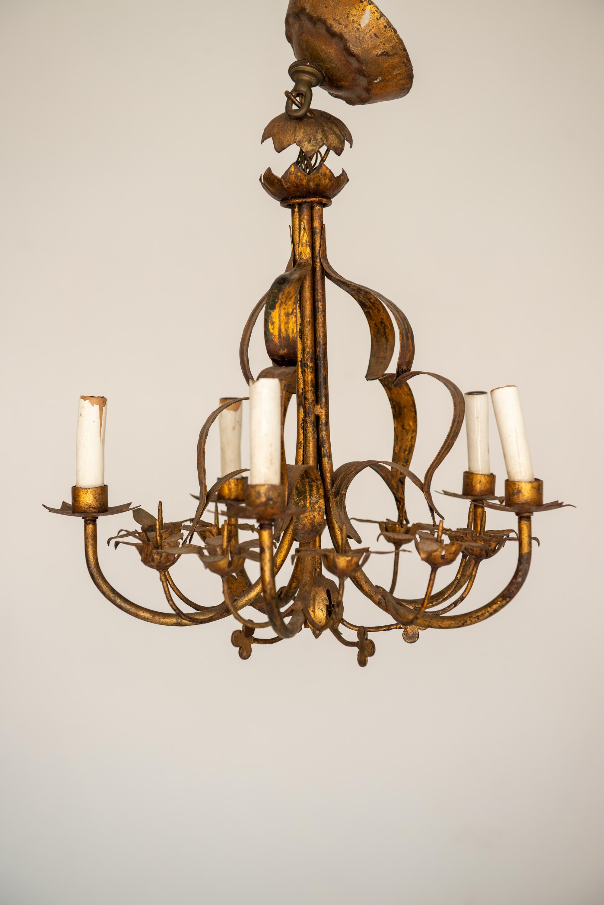 A Italian gilt metal foliage chandelier. Decorated with flower blossoms, clover, leaves, and an original canopy. Diameter: 16