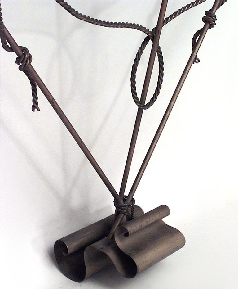 Italian Mid-Century (1940s) style gilt iron console table with rectangular grey marble top on a trident & rope twist base.

Needs to be mounted or secured to a wall.