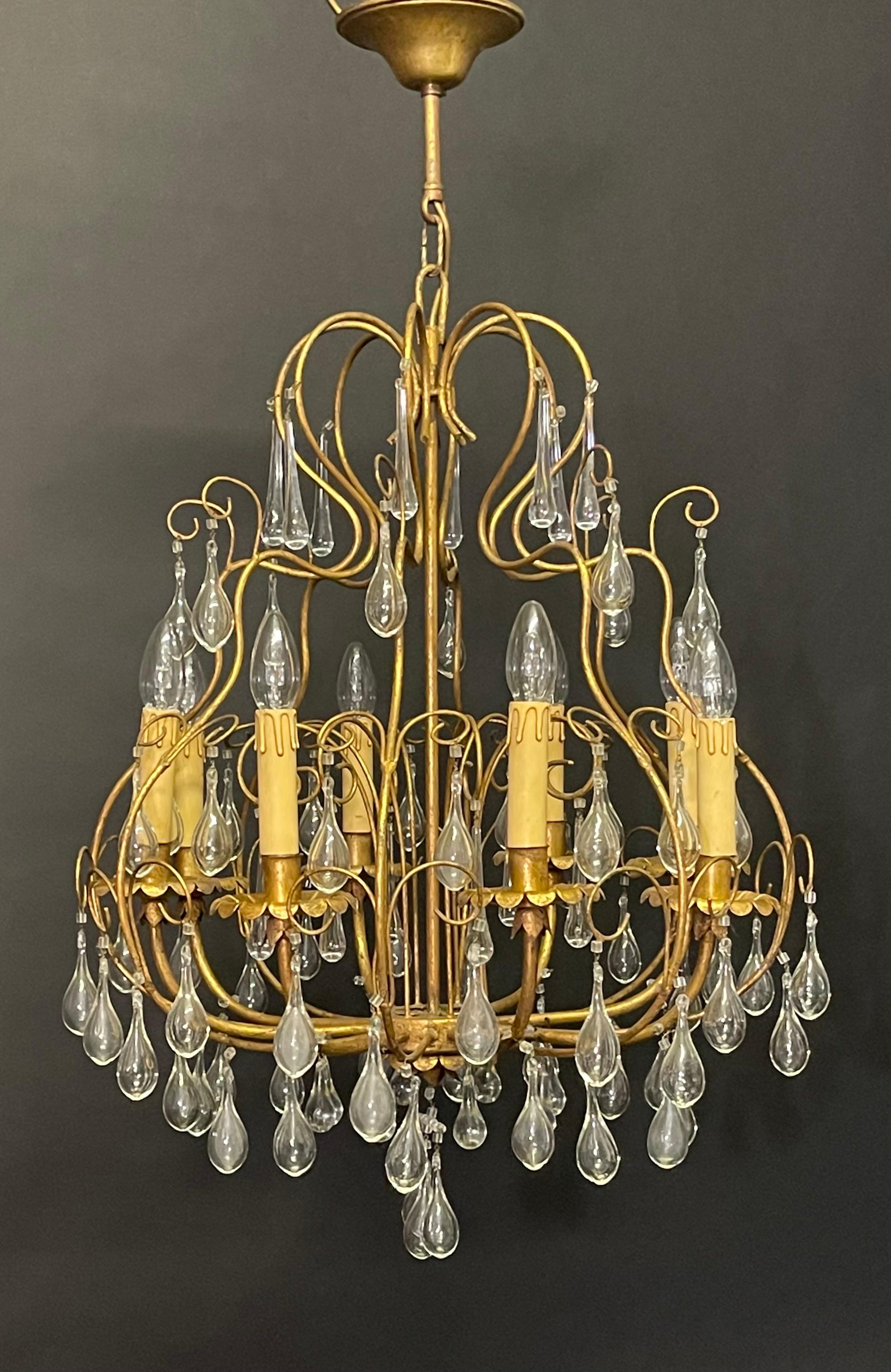 A wonderful Italian eight - light chandelier, circa 1960s.
This beautiful handcrafted chandelier is made of gilt iron, decorated with Murano tear drops.
Socket: 8 x E14 for standard screw bulbs.
(New wiring for US standards on request).
  

