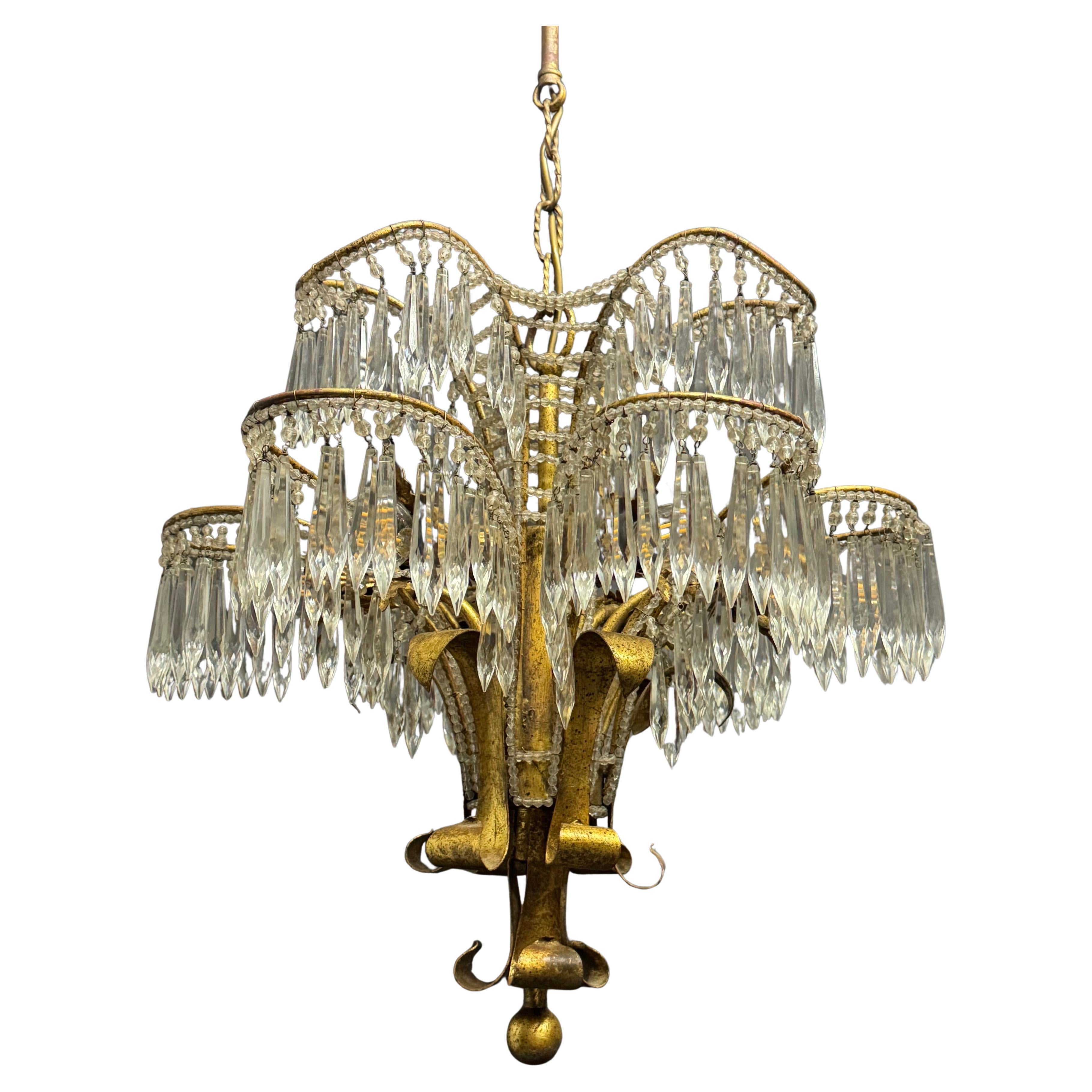 A wonderful beaded gilt iron and cut-crystal palm tree chandelier, Italy attr. to G.Banci, Italy, circa 1970s.
Socket: 6 x e14 (Edison) for standard screw bulbs.
The condition is excellent.
 New wiring for US standards on request.
  