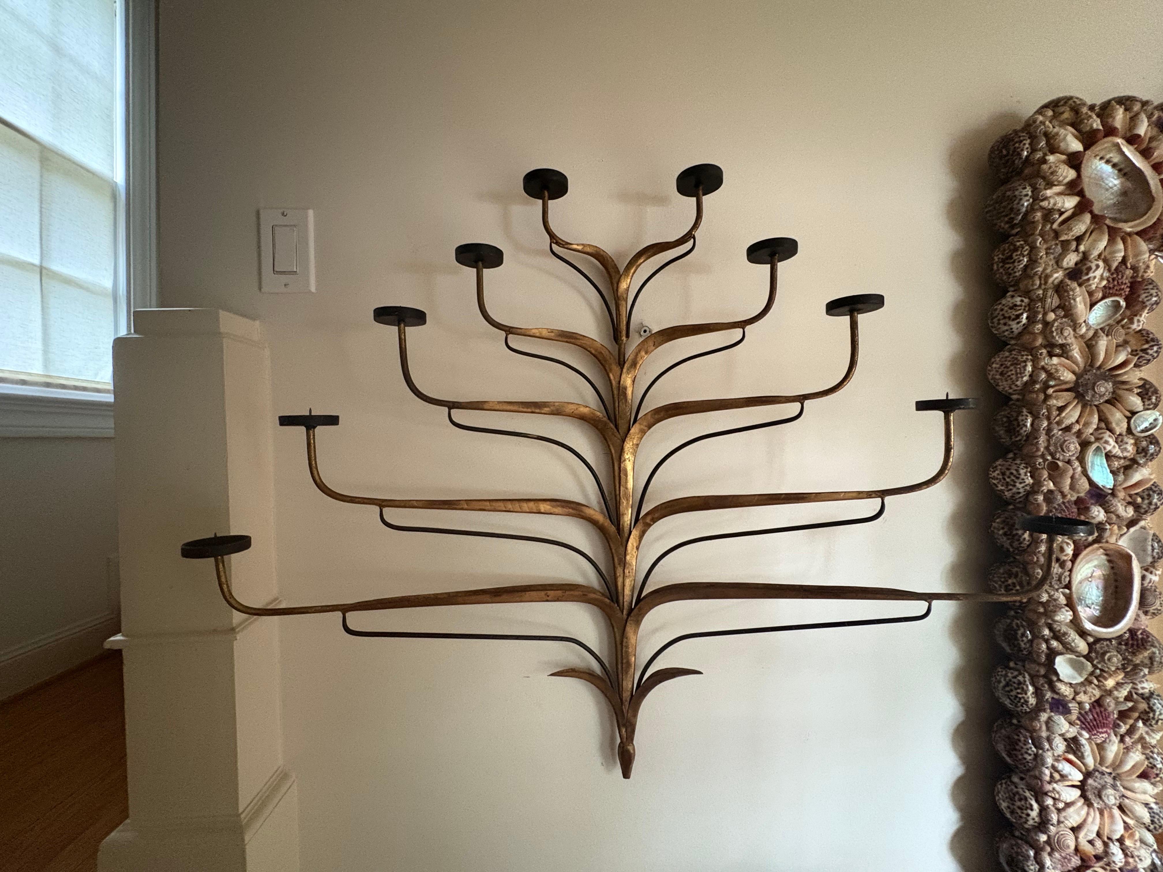 Italian Gilt Iron Candle Sconce.
Offered is a large scale Italian mid century gilt iron 10 ten arm candle sconce. This beautiful single sconce would be great in a hallway or staircase where only one light is needed. Easily wired if desired or used