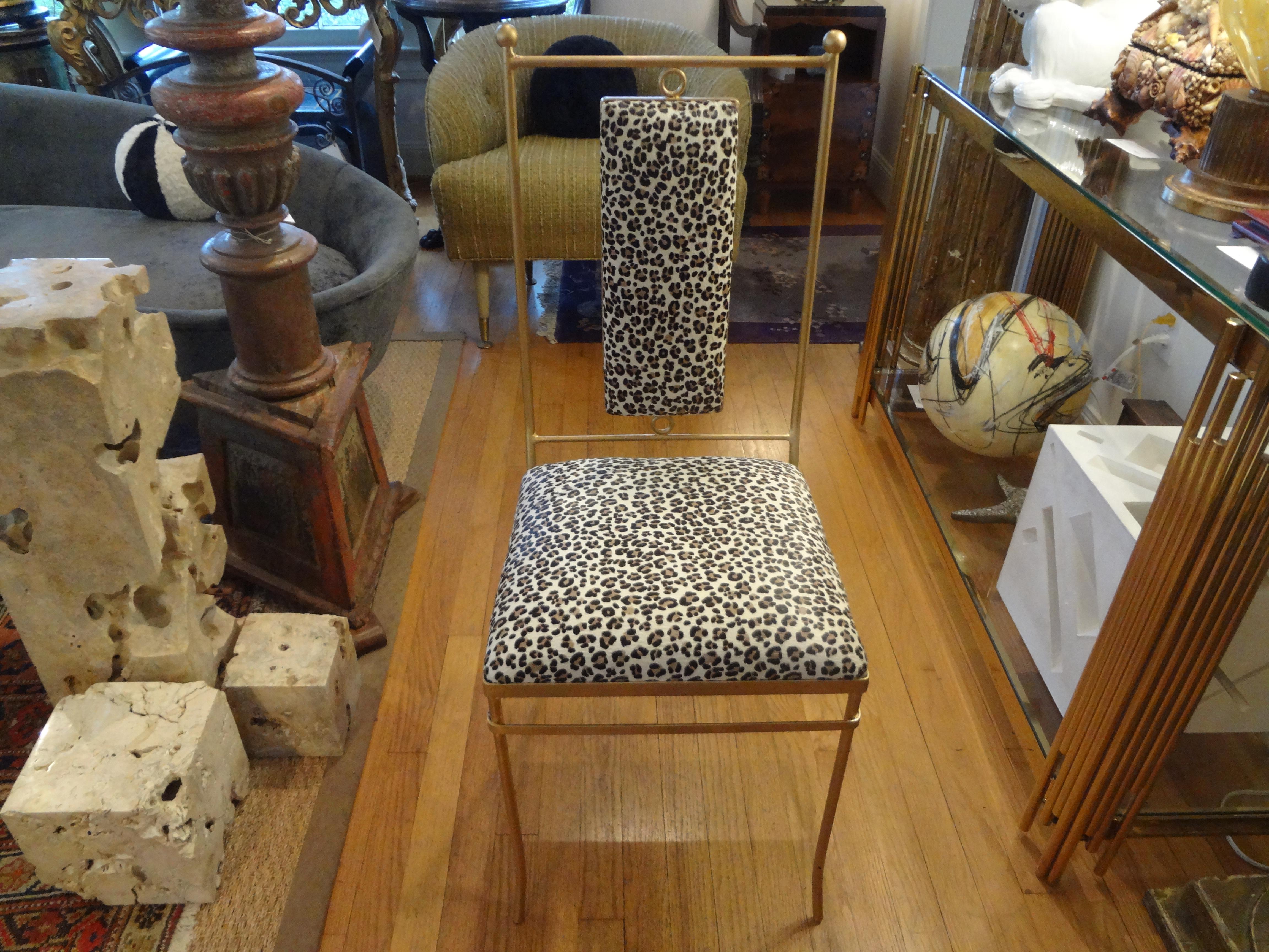 Great Mid-Century Modern Italian gilt iron side chair professionally upholstered in imported Italian leopard printed hide.
This Hollywood Regency Italian Chiavari style chair is the perfect side chair, vanity chair, powder room chair or desk chair.