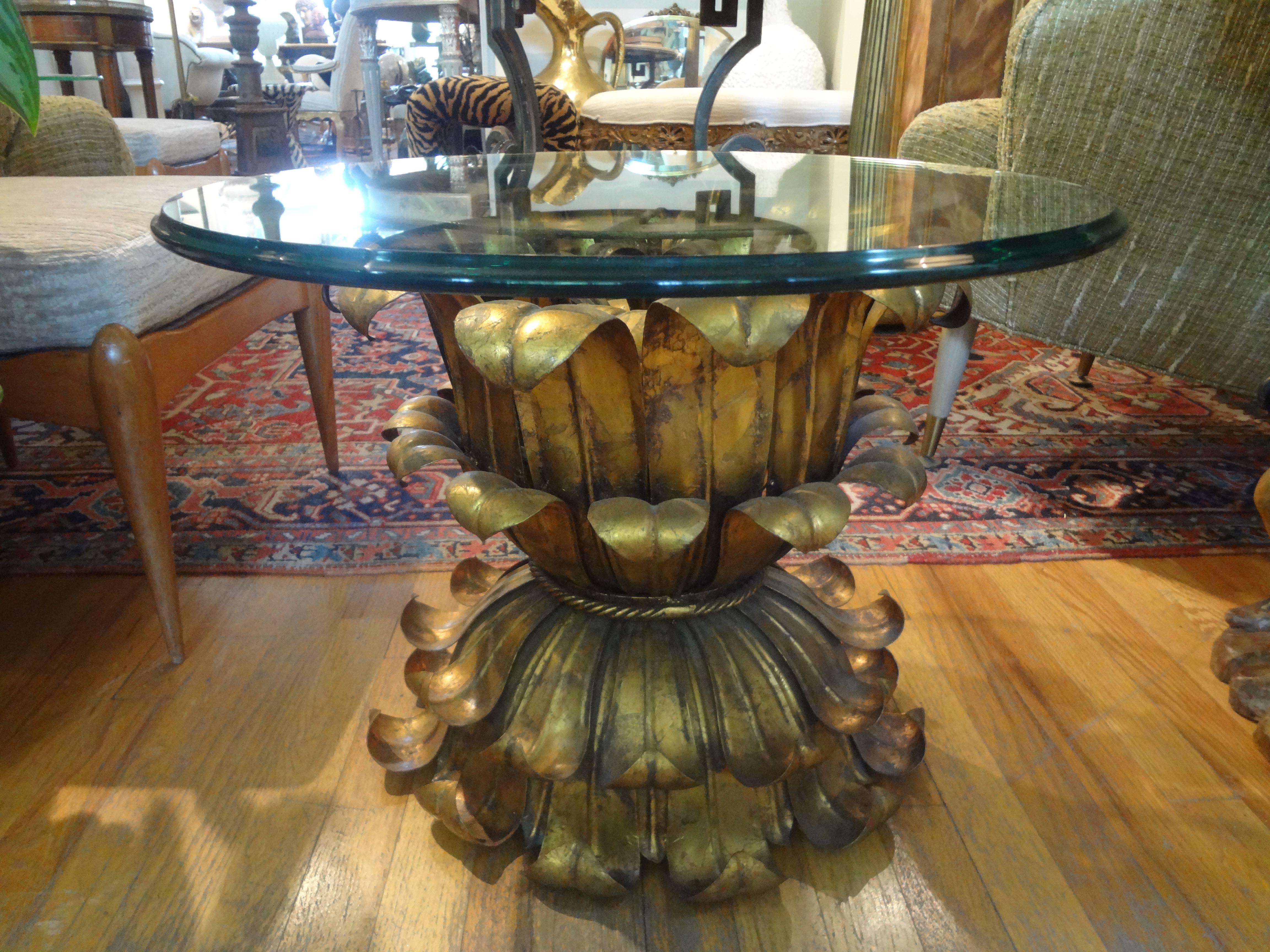 Stunning vintage Italian gilt iron or gilt metal table with a beveled glass top. Our Hollywood Regency Italian gilt iron plume table or palm frond table is the perfect side table, drinks table, guéridon, coffee table or cigarette table. This Italian