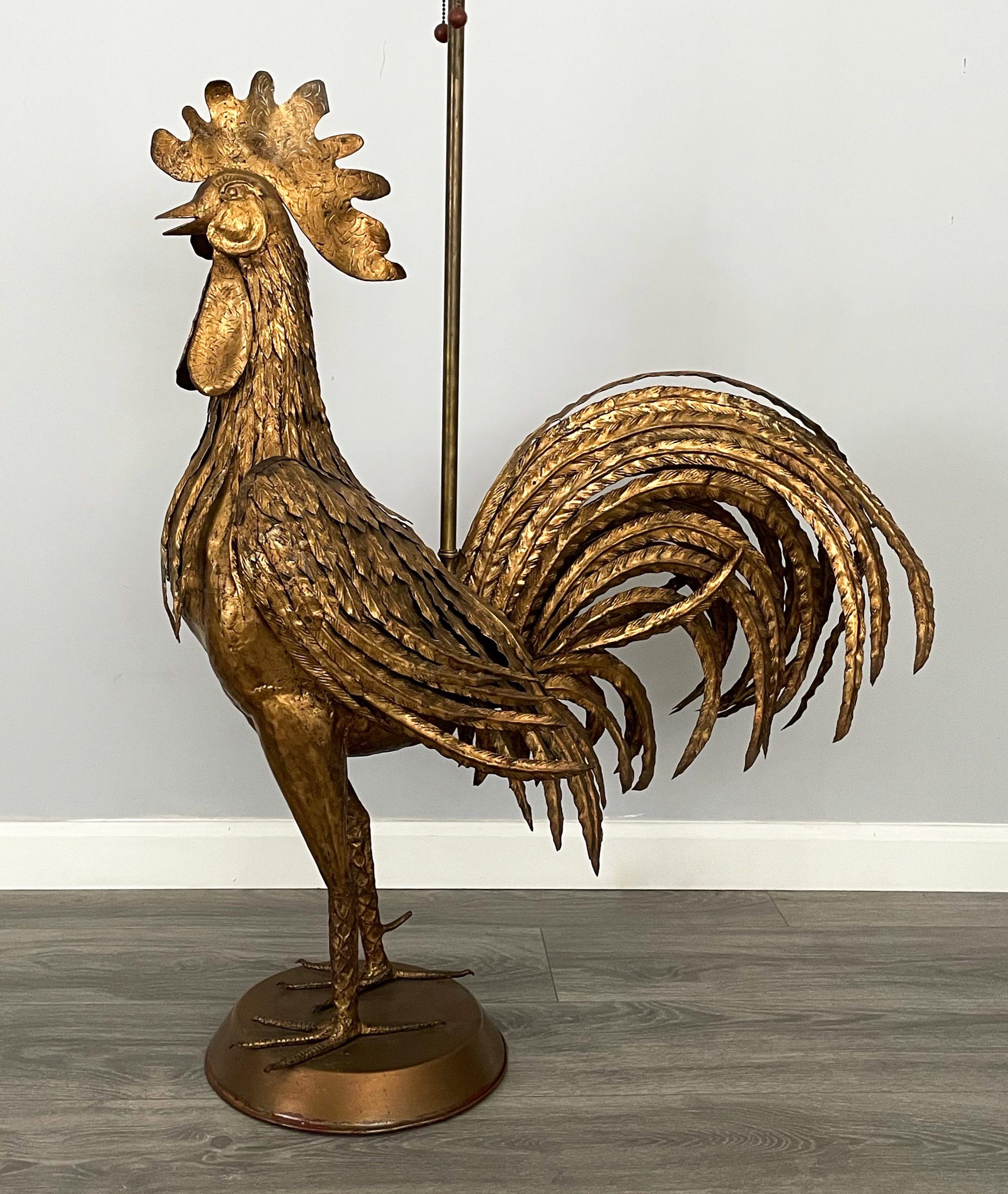 Handsome, Italian 1960s gilt iron floor lamp in the shape of a rooster imported by the Marbro Lamp Company, Los Angeles. 

The lamp consists of a intricately-detailed gilded iron sculpture depicting a rooster standing on a round pedestal.

The