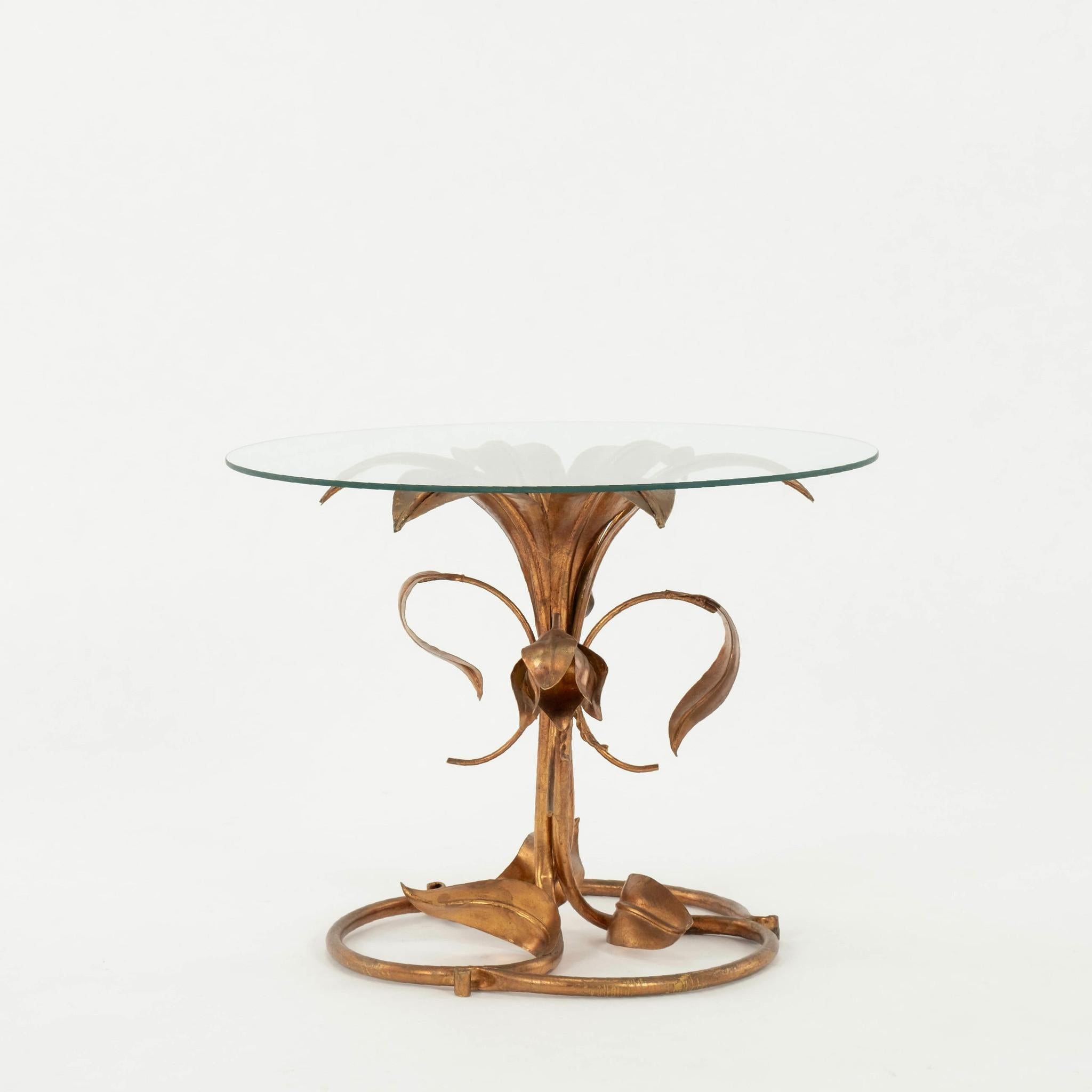 Vintage Italian gilt metal lily table with glass top.