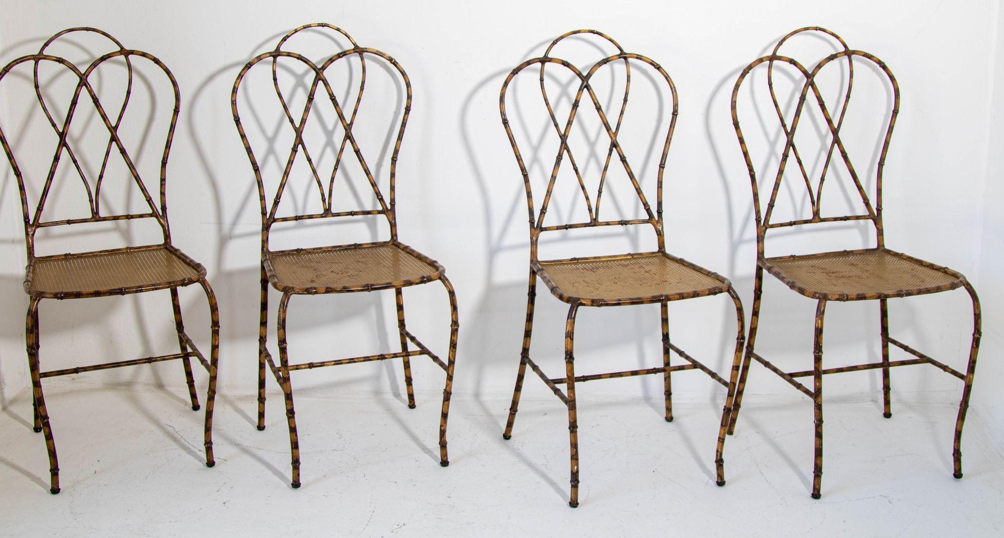 Italian Gilt Metal Faux Bamboo Dining Chairs 1950s Set of 4.
The listing is for the set of 4 chairs, we also have the matching table base if interested.
Set of Four arched Faux Bamboo Chairs in Gilt on brown metal,
Eye-catching 1950s Italian gilt