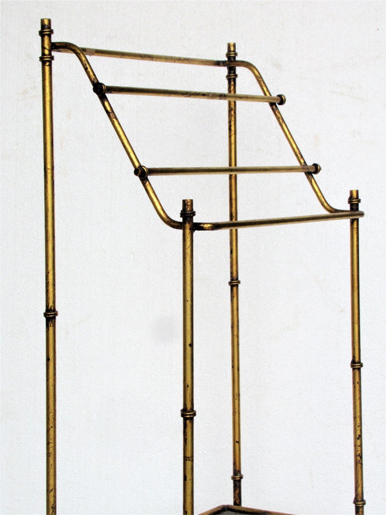 Free standing solid steel towel rack with lower mesh shelf.
 Overall beautifully aged lightly worn original gilded surface. Italy, circa 1960. Look at all pictures and read condition report in comment section.