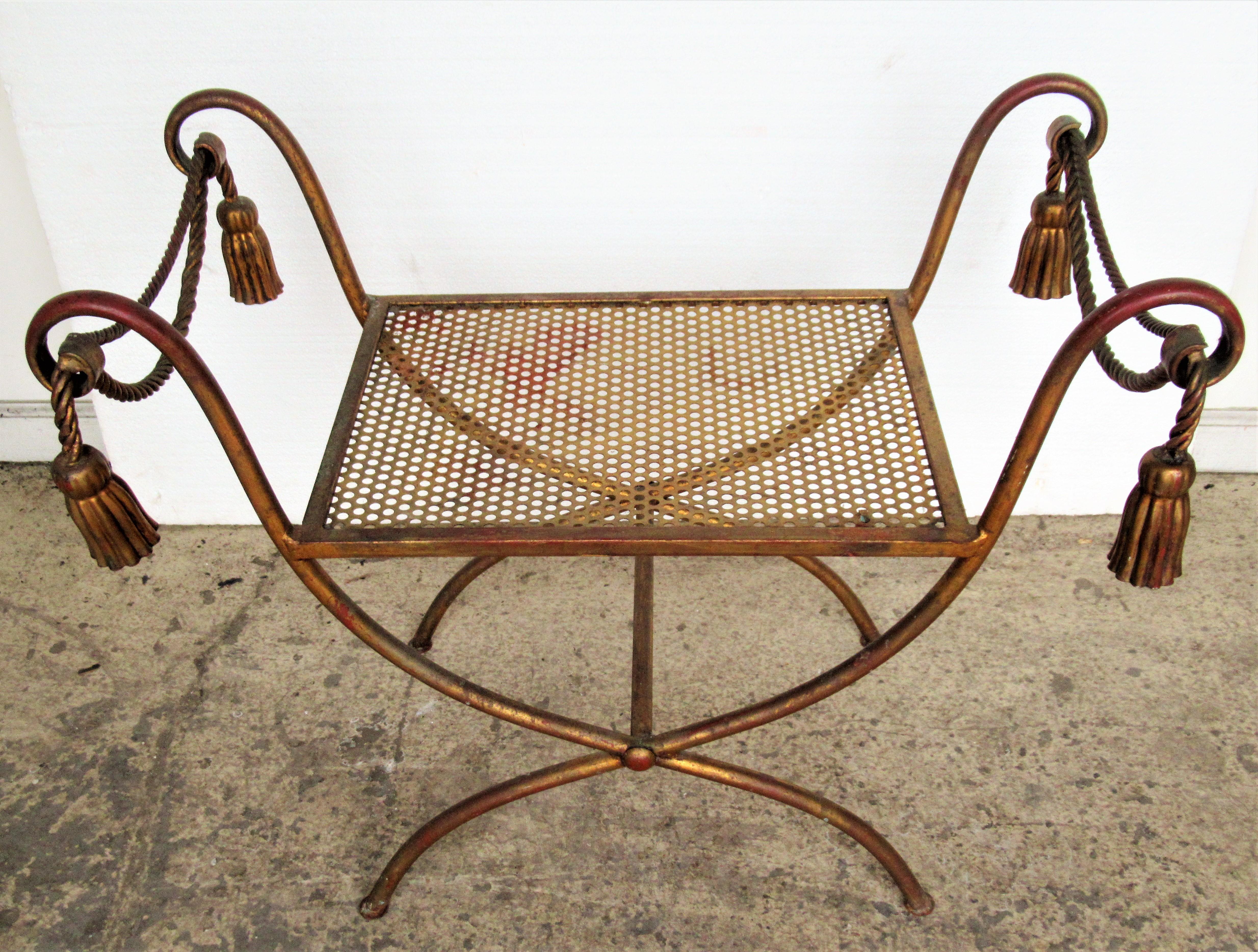 Gilt metal rope and tassel bench in the best all original beautifully aged gilded surface with areas of underlying red bole showing. Made in Italy, circa 1960. This is a good one. Look at all pictures and read condition report in comment section.